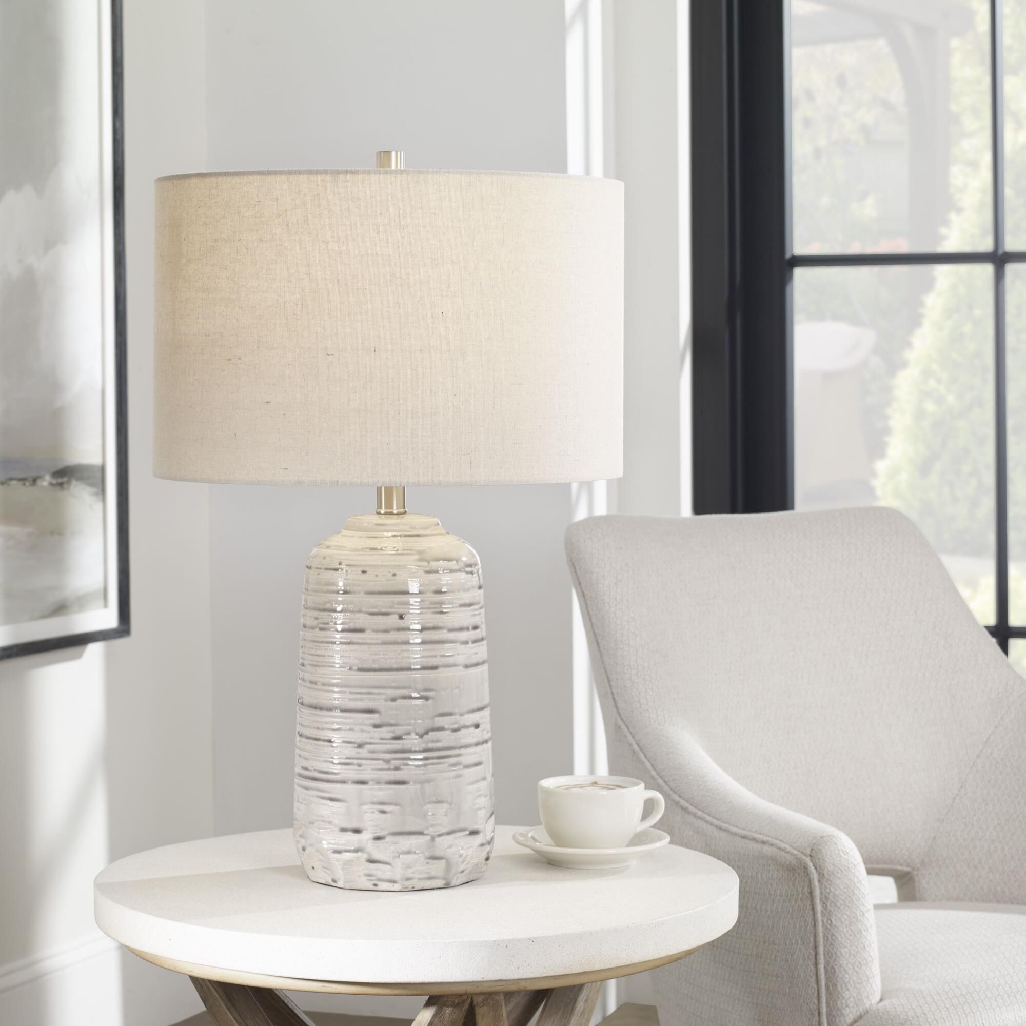 Shown in This Ceramic Table Lamp Has A Unique Shape Featuring A Traditional Style Urn Body That Has Cut Edges finish and Round Hardback Drum shade