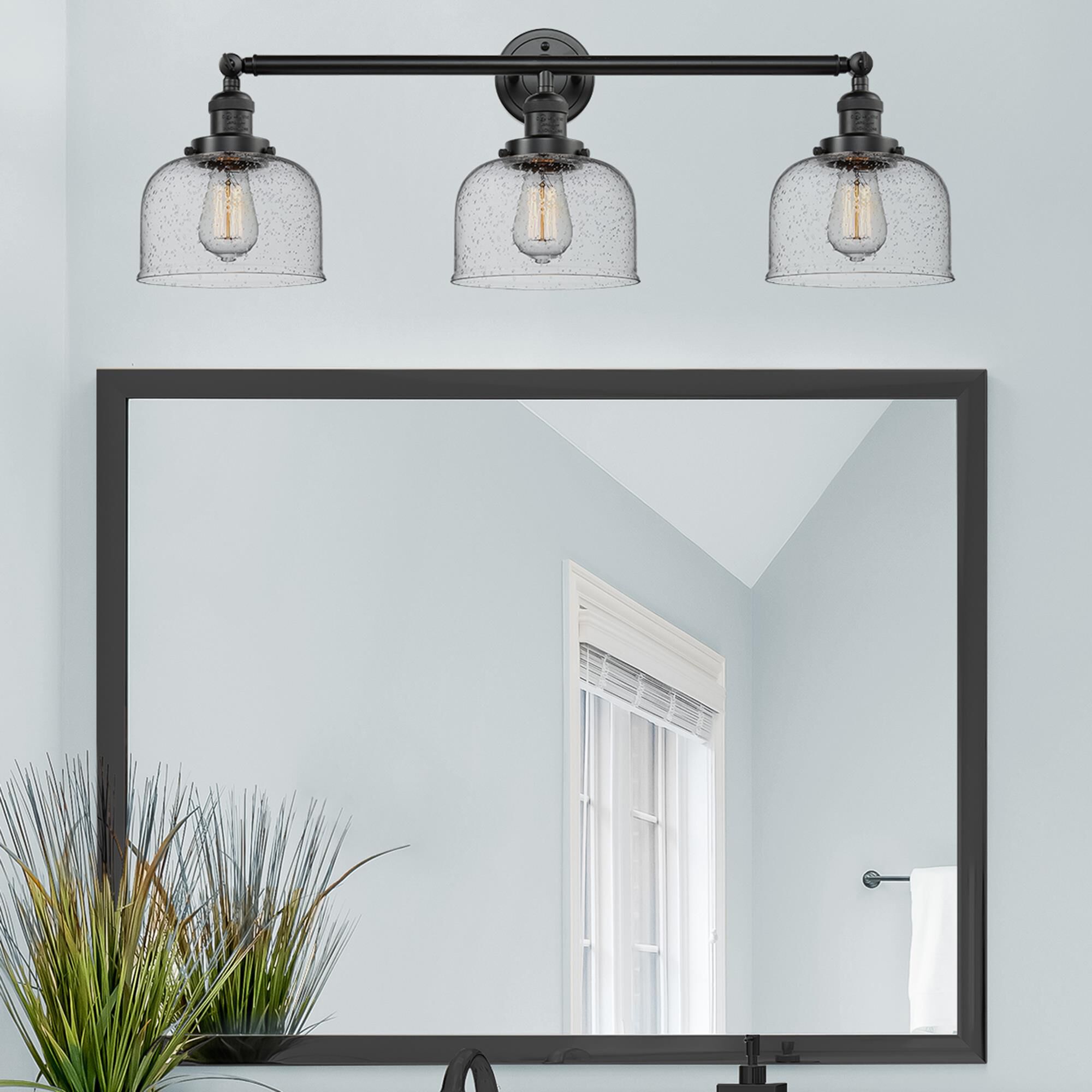 Shown in Oil Rubbed Bronze finish and Seedy glass
