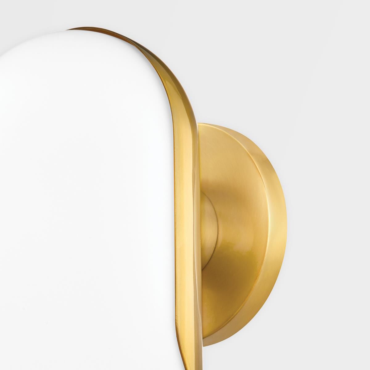 Shown in Aged Brass finish and White glass