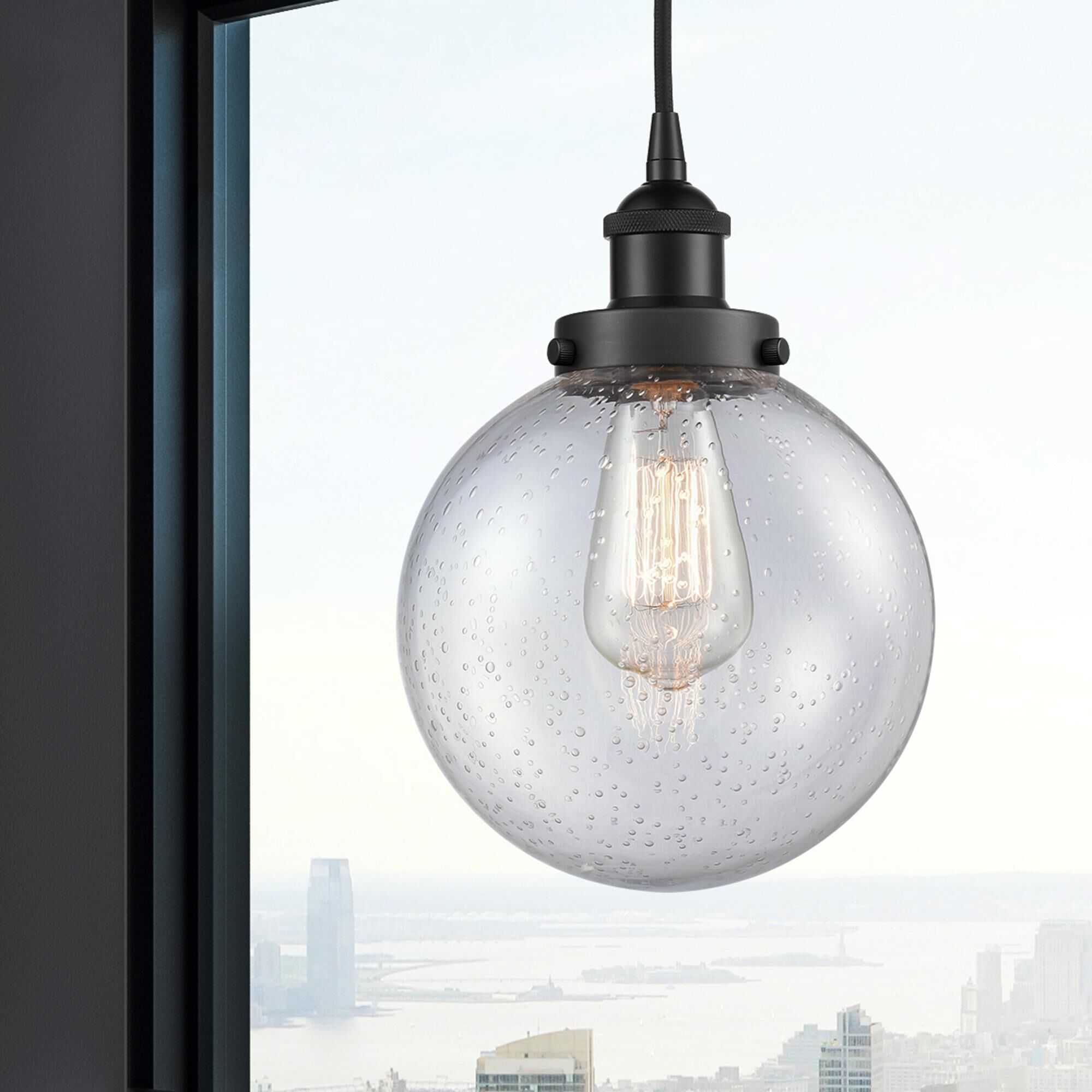 Shown in Matte Black finish and Seedy Beacon glass