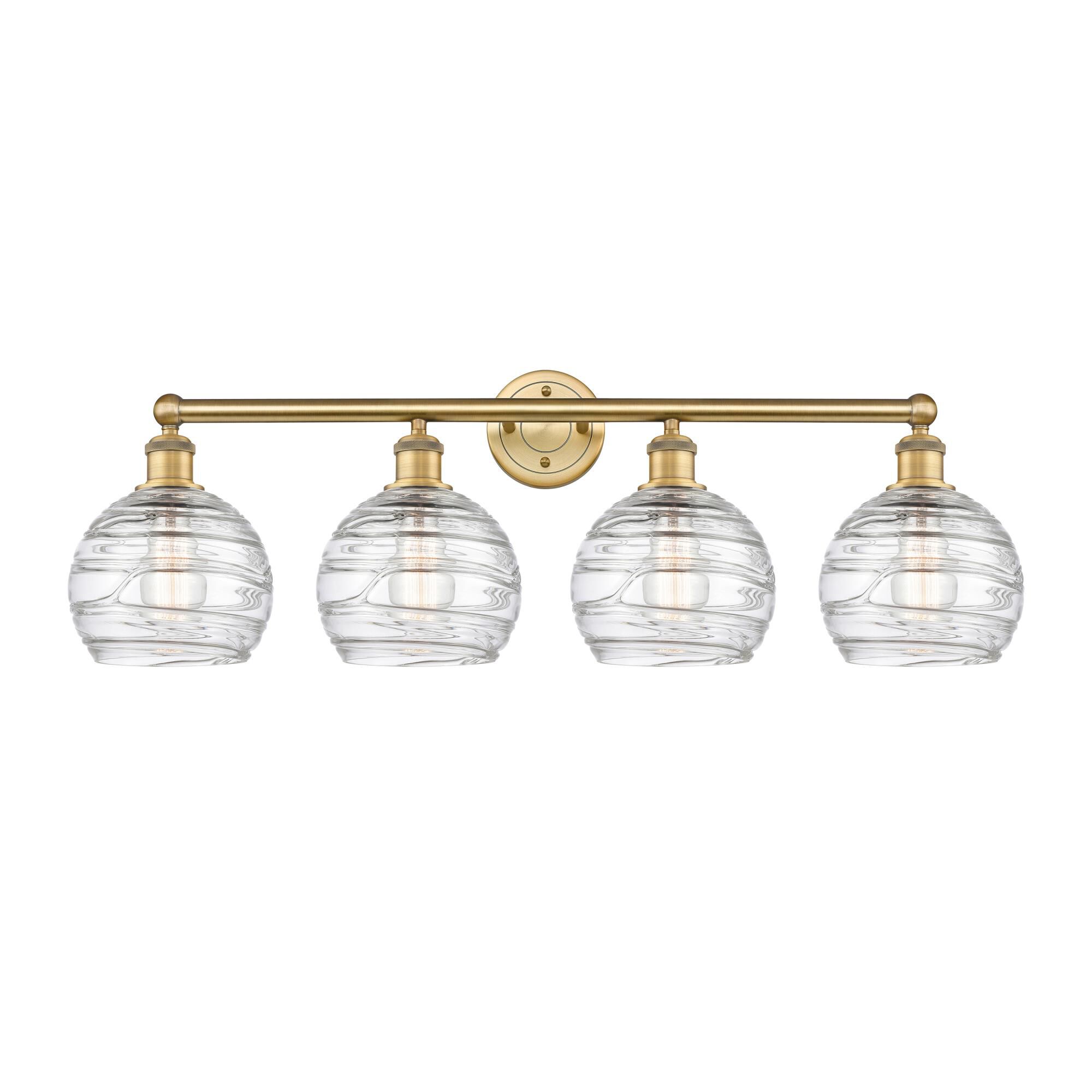 Shown in Brushed Brass finish and Clear Deco Swirl glass