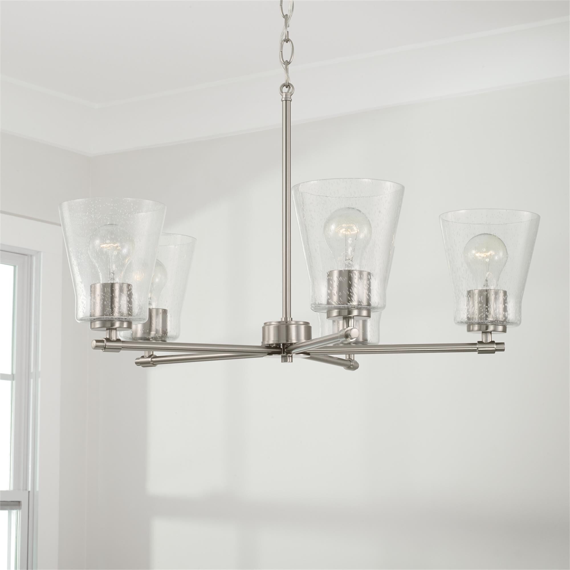 Shown in Brushed Nickel finish and Clear Seeded glass