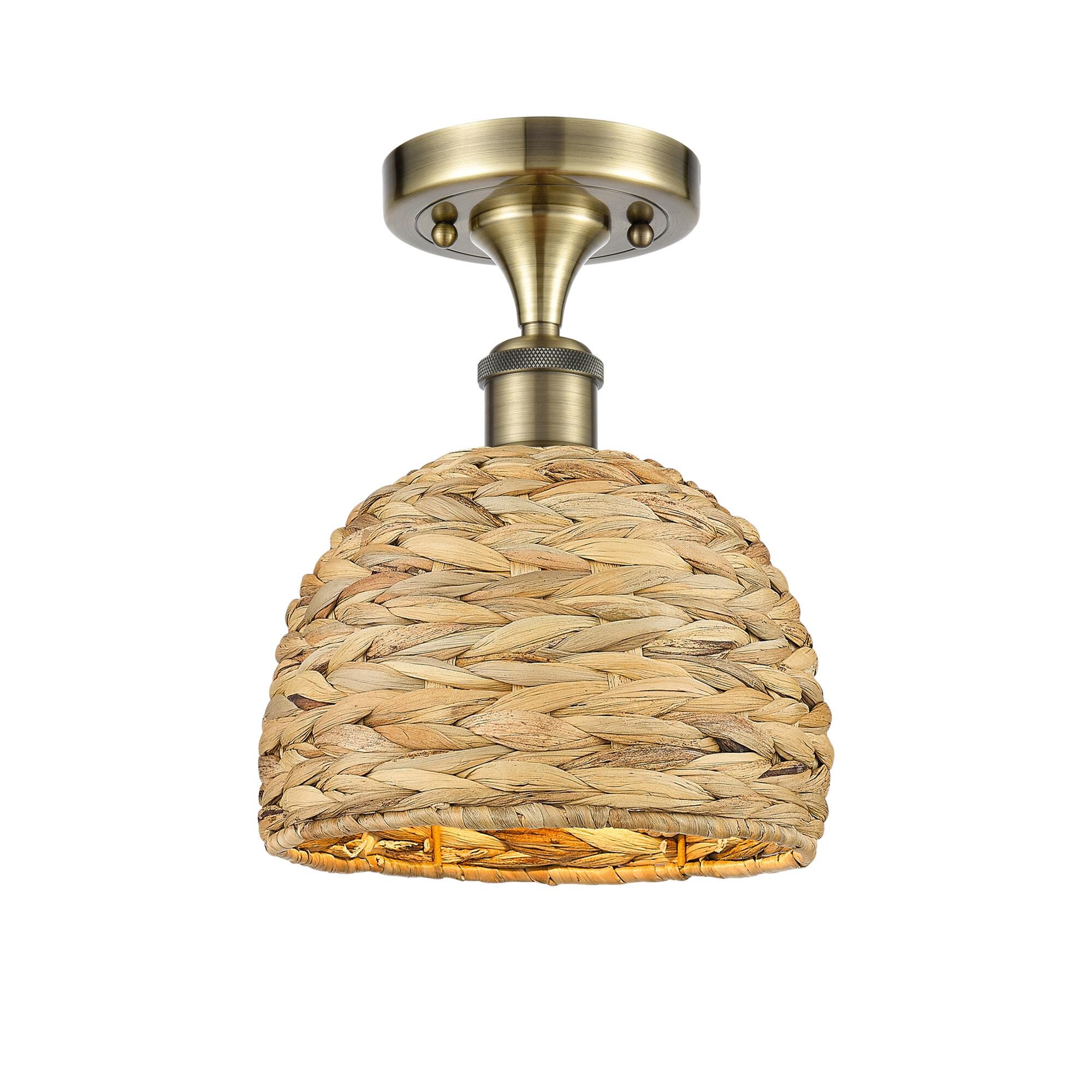 Shown in Antique Brass finish and Natural shade