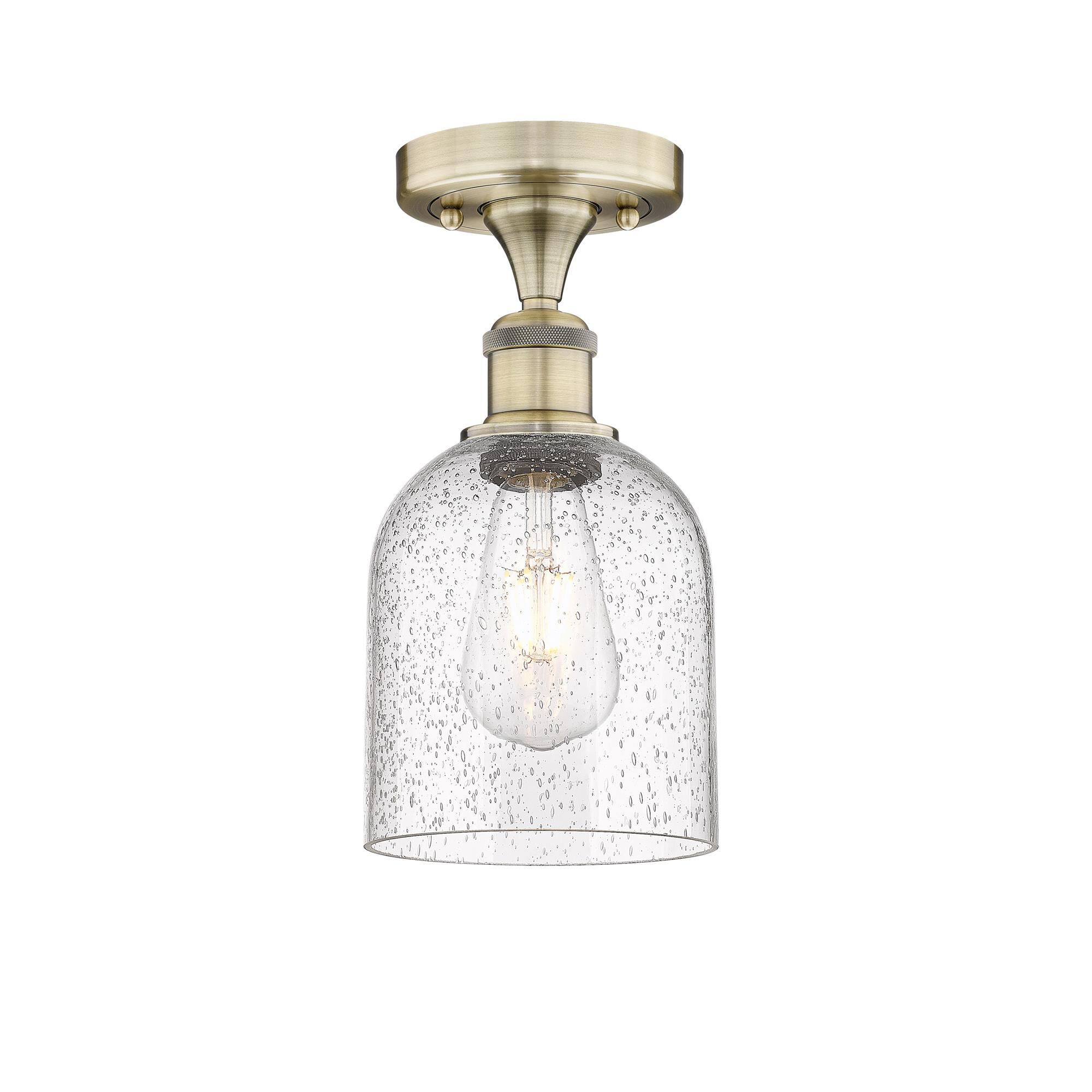 Shown in Antique Brass finish and Seedy glass