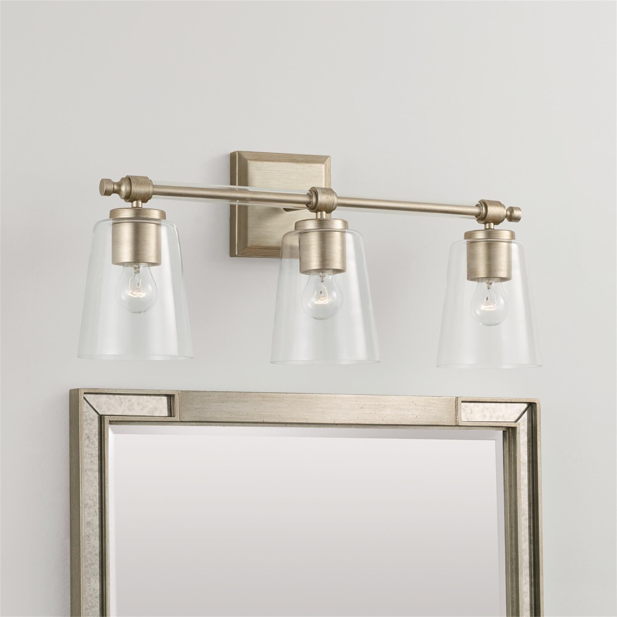 Shown in Brushed Champagne finish and Clear glass