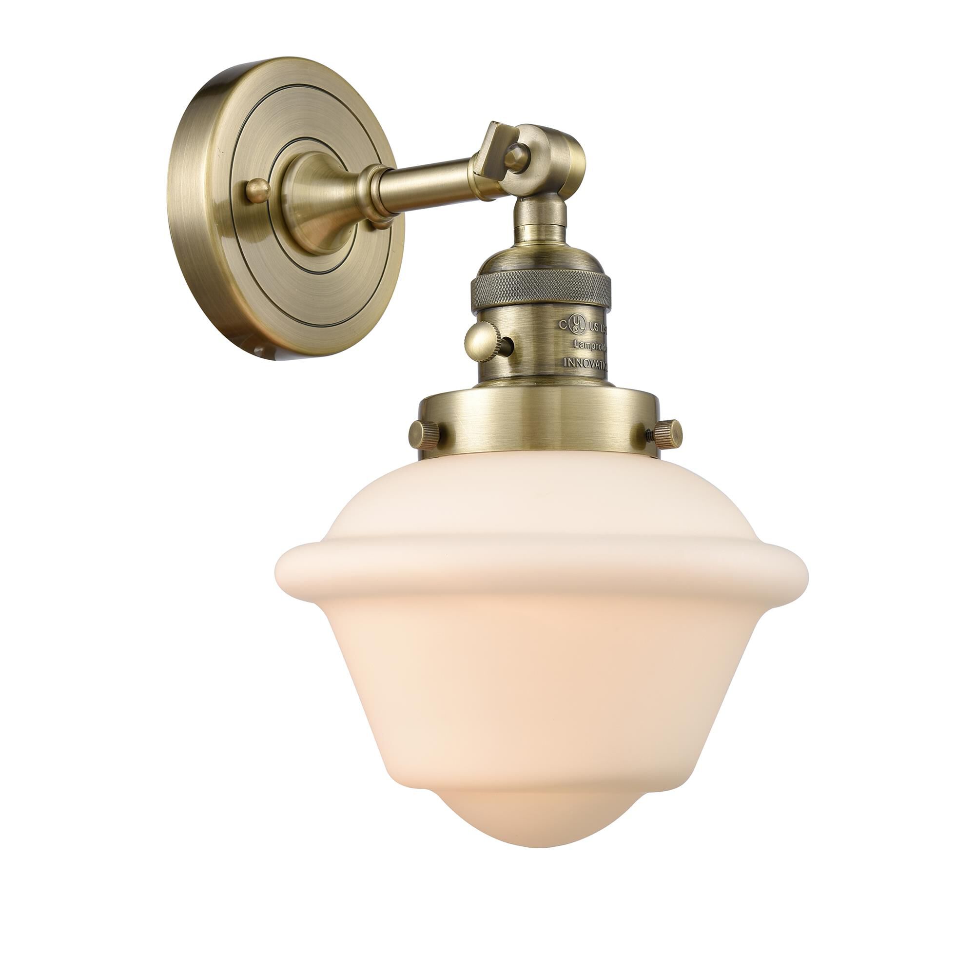 Shown in Antique Brass finish and Matte White Cased glass and Switch on Socket accent