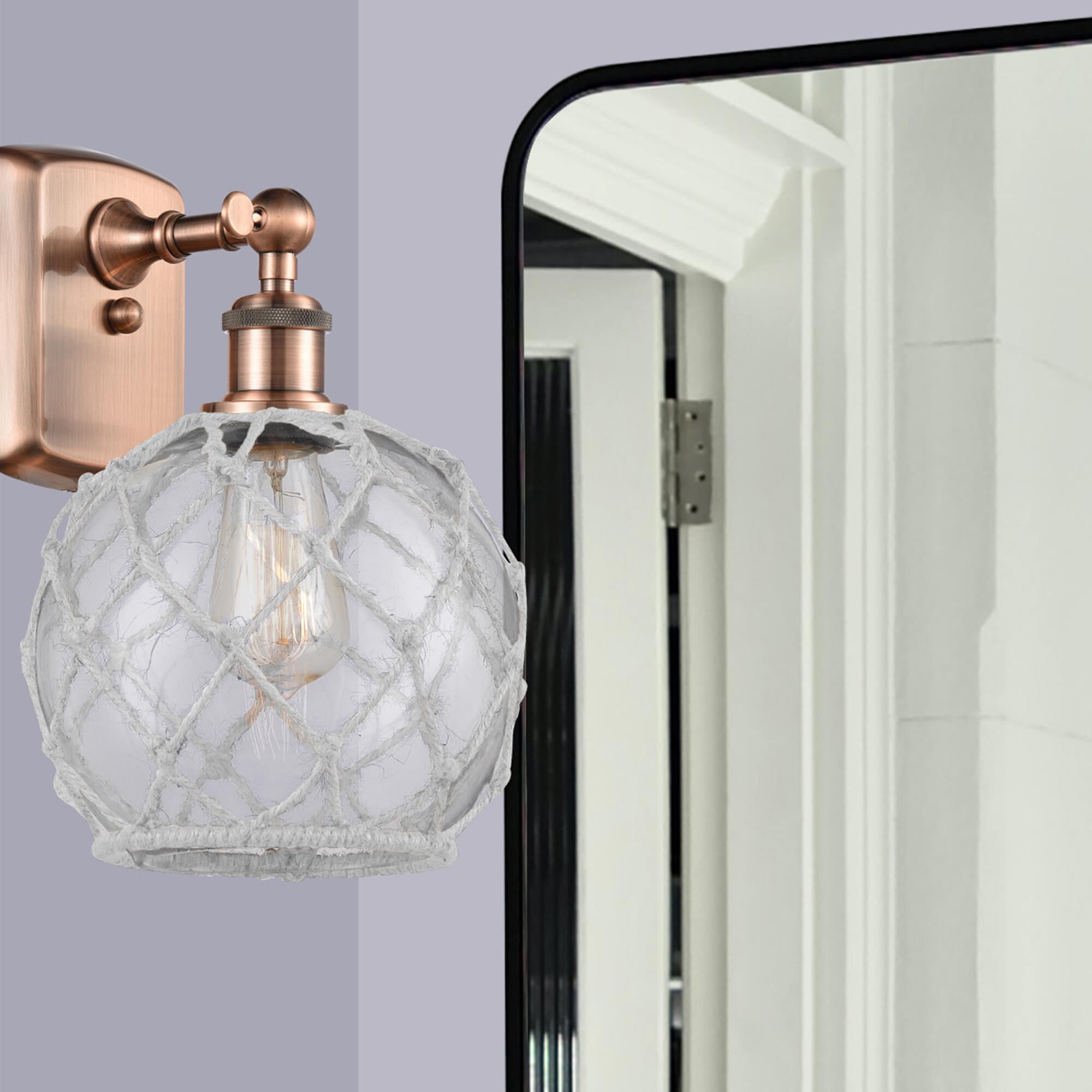 Shown in Antique Copper finish and Sphere glass and Glass And Rope shade
