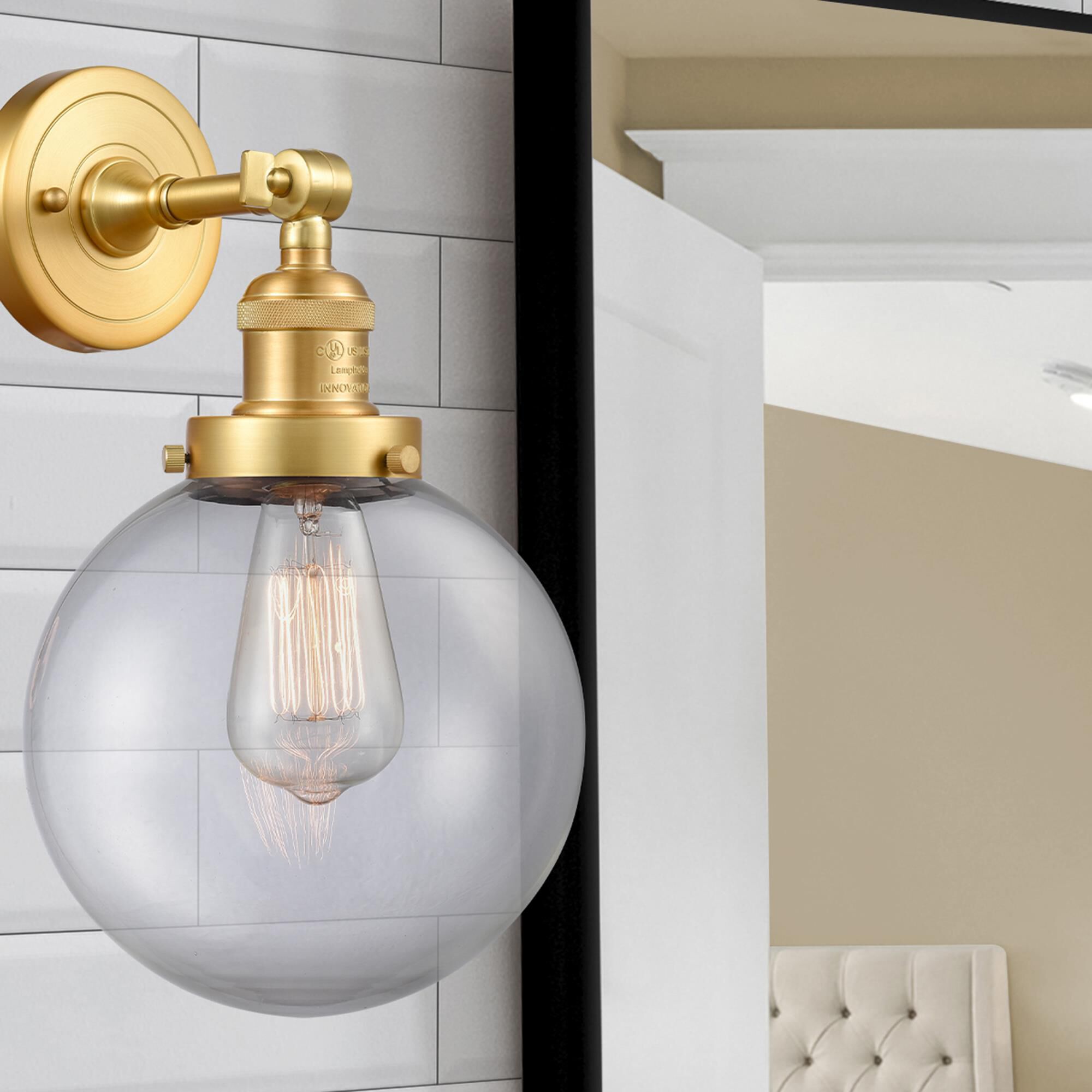 Shown in Satin Gold finish and Clear Beacon glass