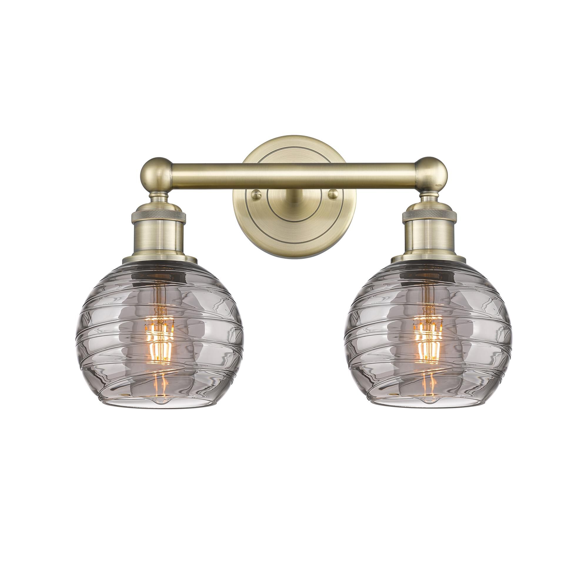Shown in Antique Brass finish and Light Smoke Deco Swirl glass