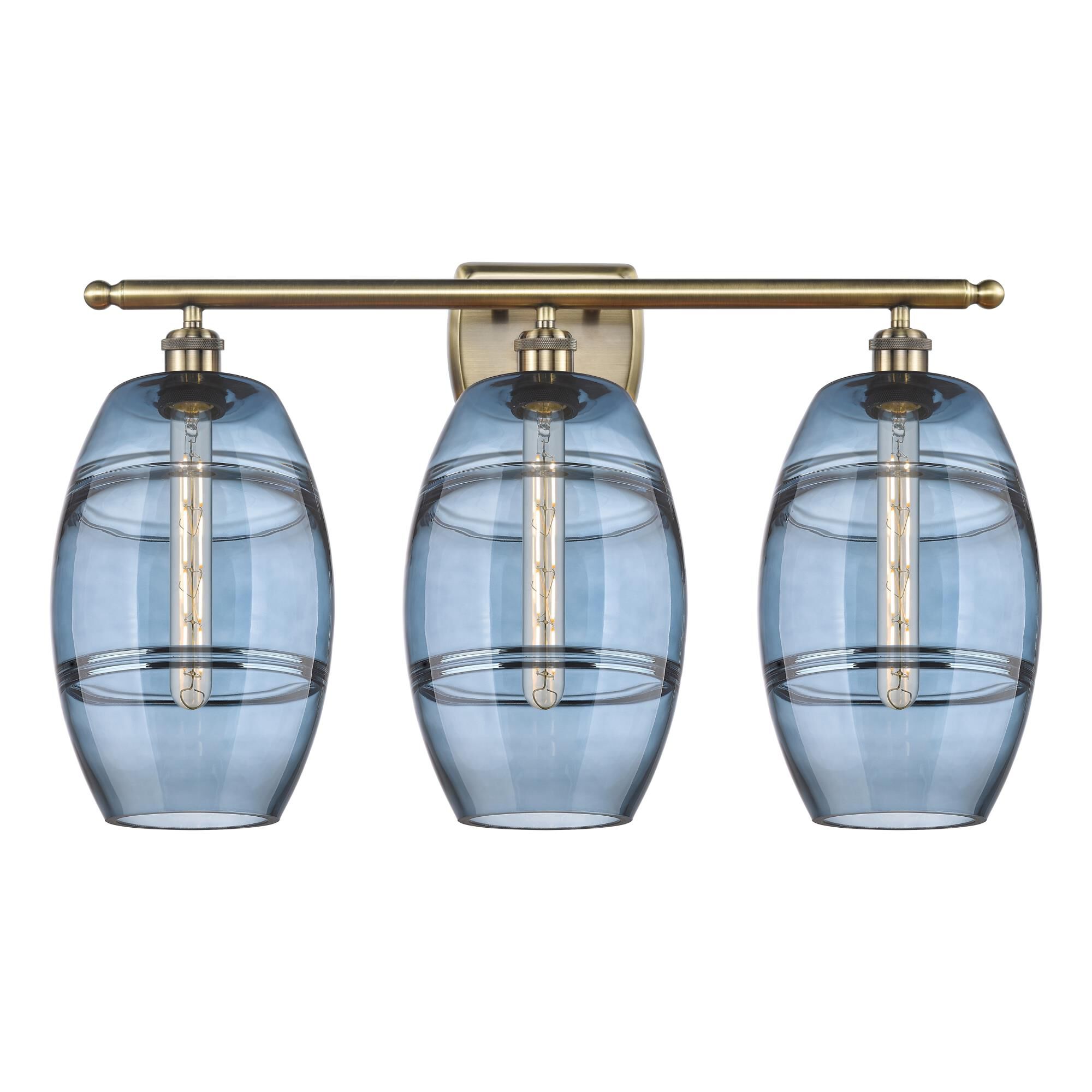 Shown in Antique Brass finish and Princess Blue glass