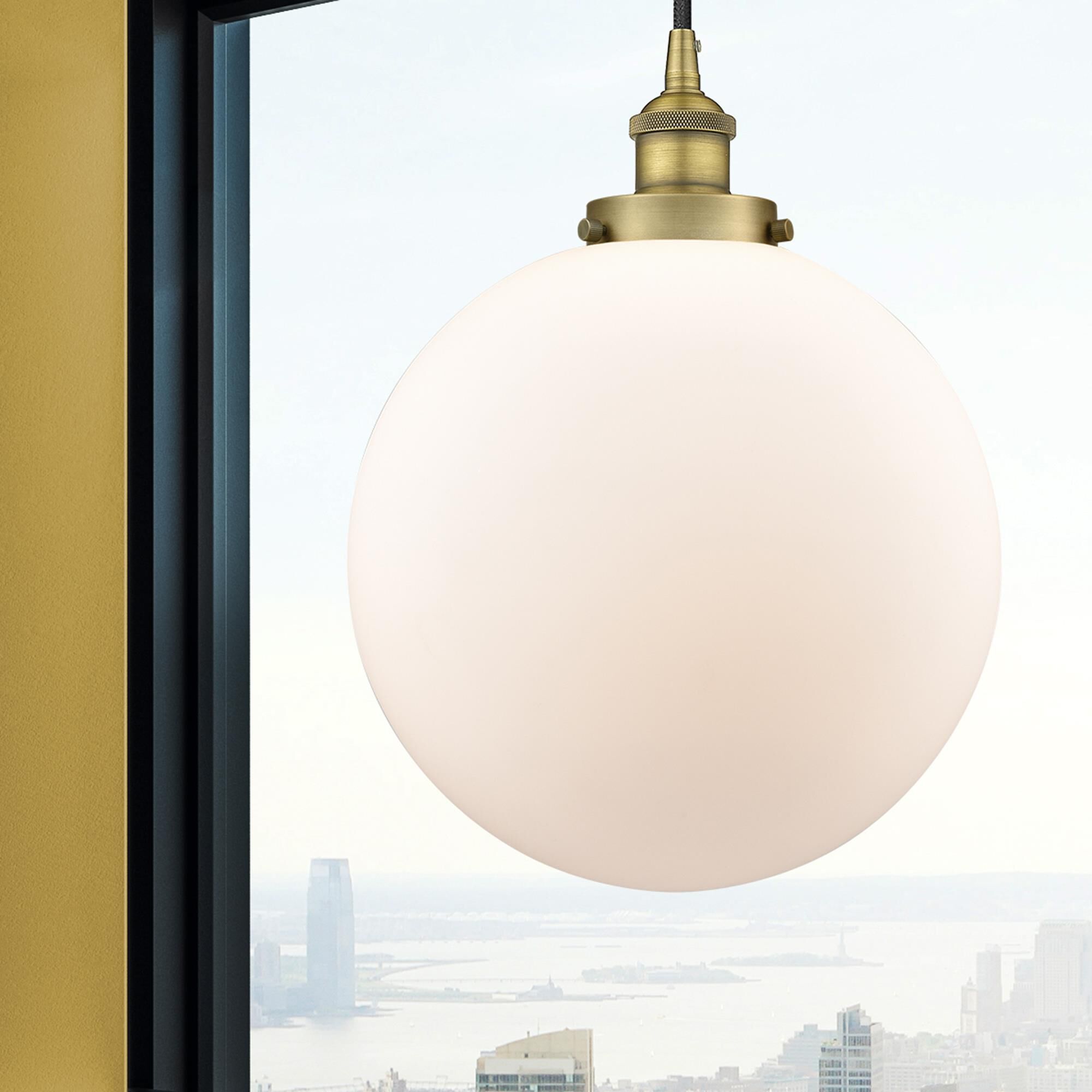 Shown in Brushed Brass finish and Matte White Cased Beacon glass