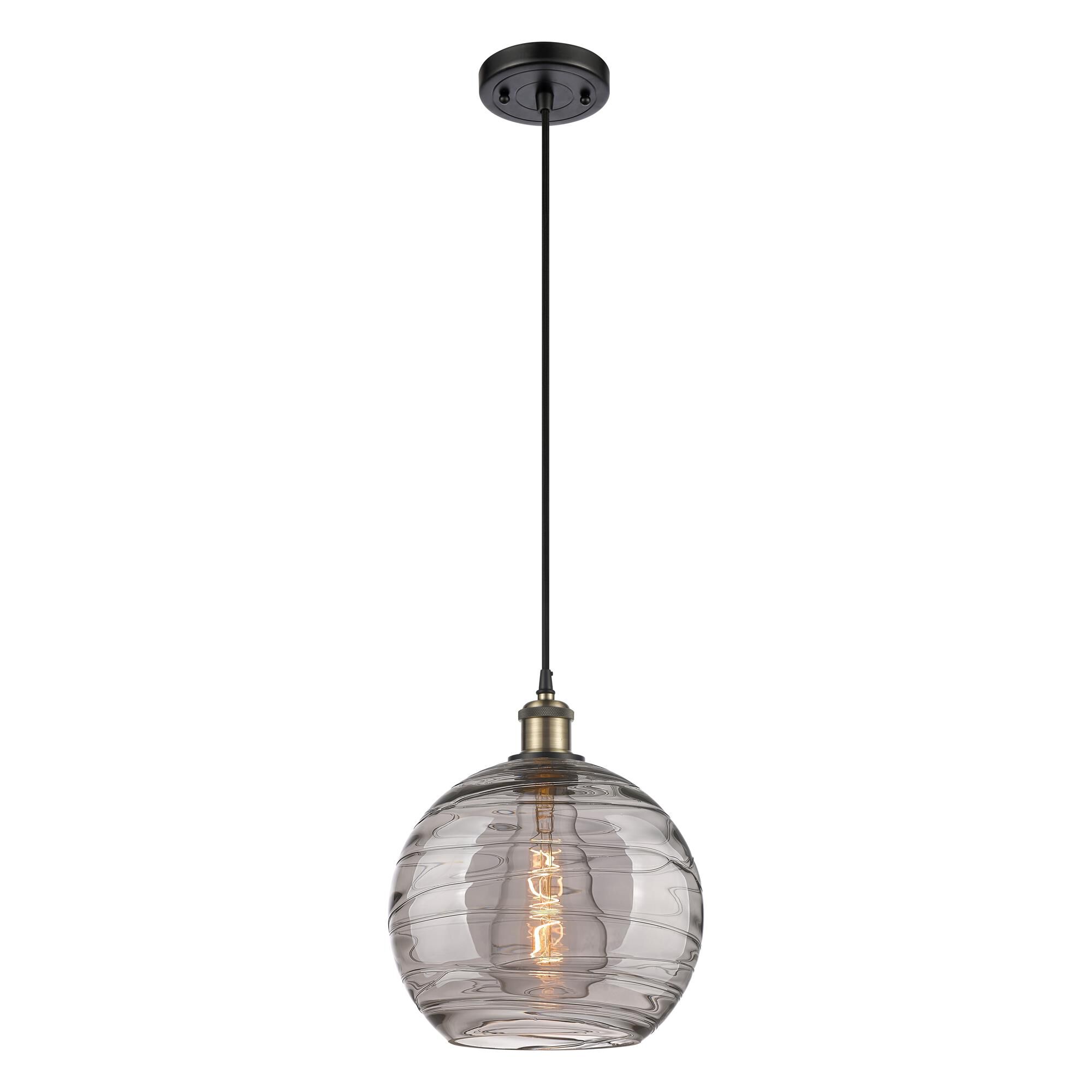 Shown in Black Antique Brass finish and Light Smoke Deco Swirl glass