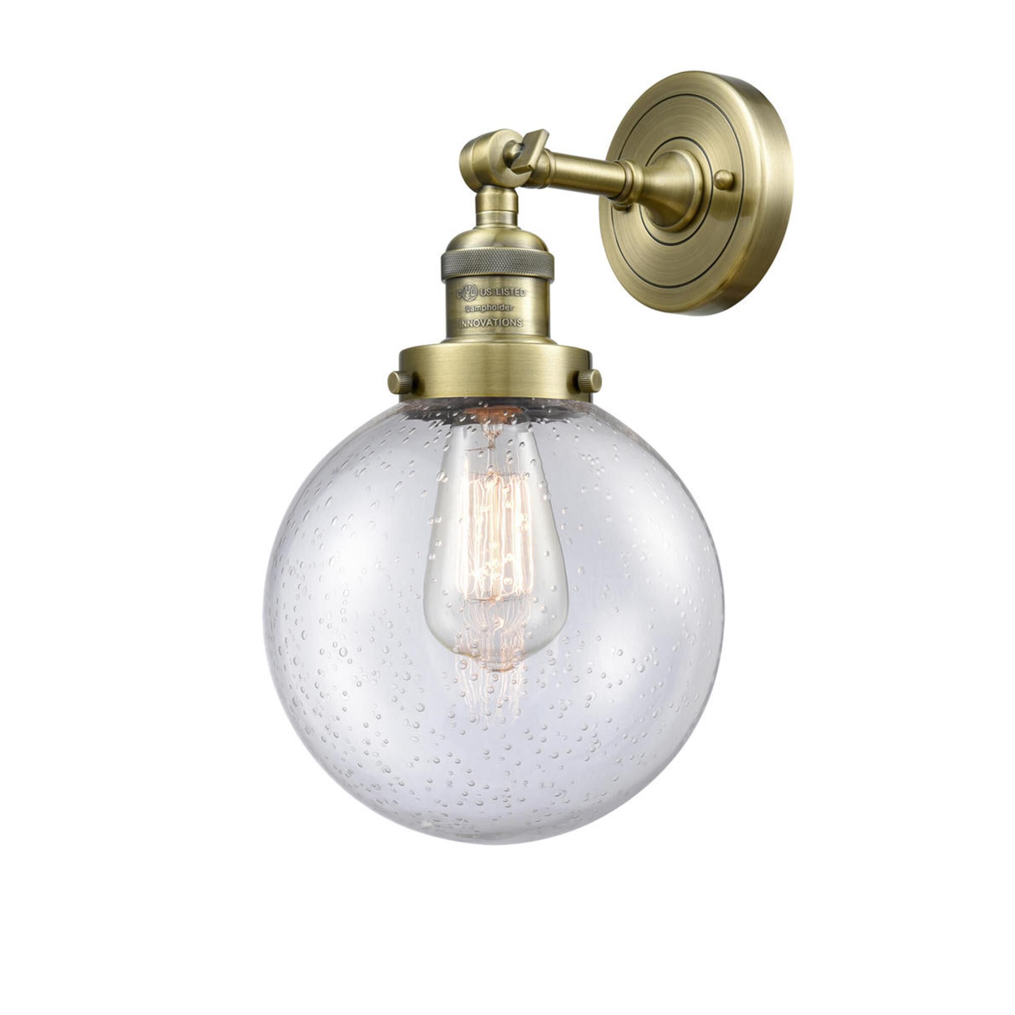 Shown in Antique Brass finish and Seedy glass and No Accent accent