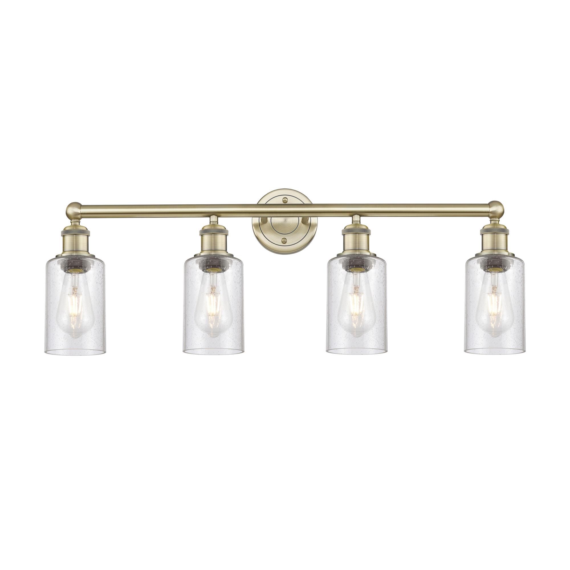 Shown in Antique Brass finish and Seedy glass