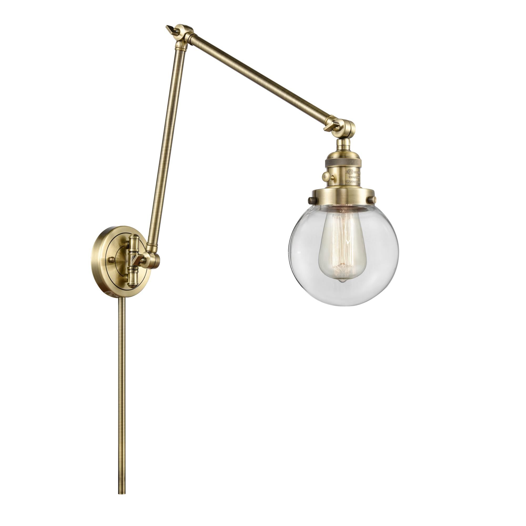 Shown in Antique Brass finish and Clear Beacon glass