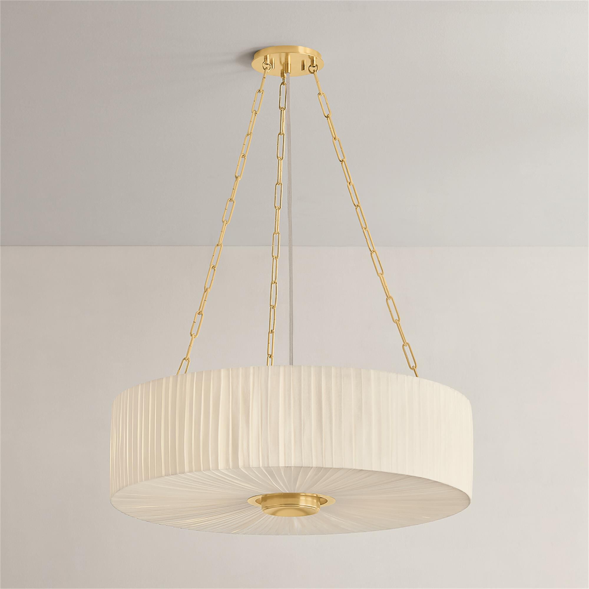 Shown in Aged Brass finish and Ivory Linen shade