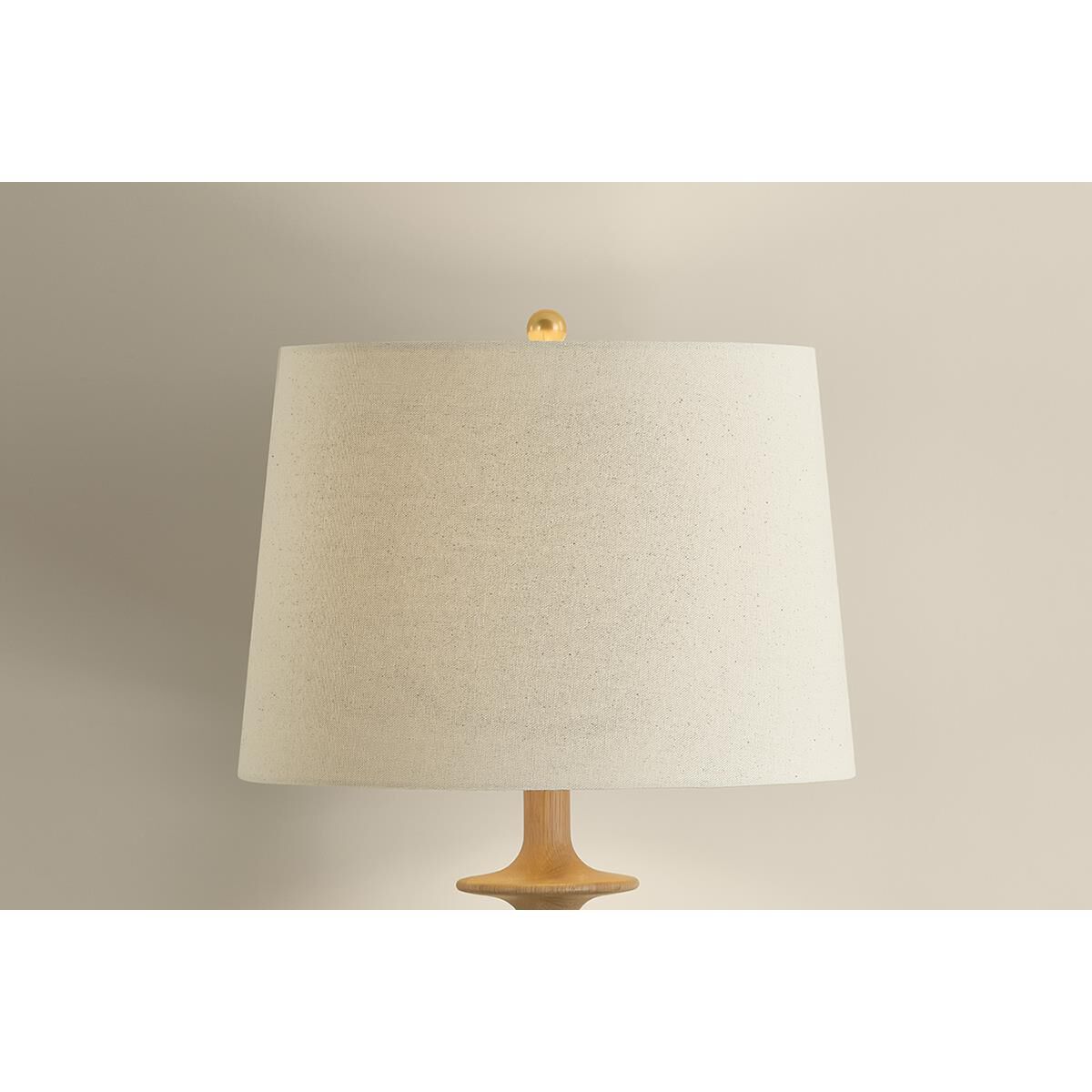 Shown in Aged Brass finish and Wheat Linen shade