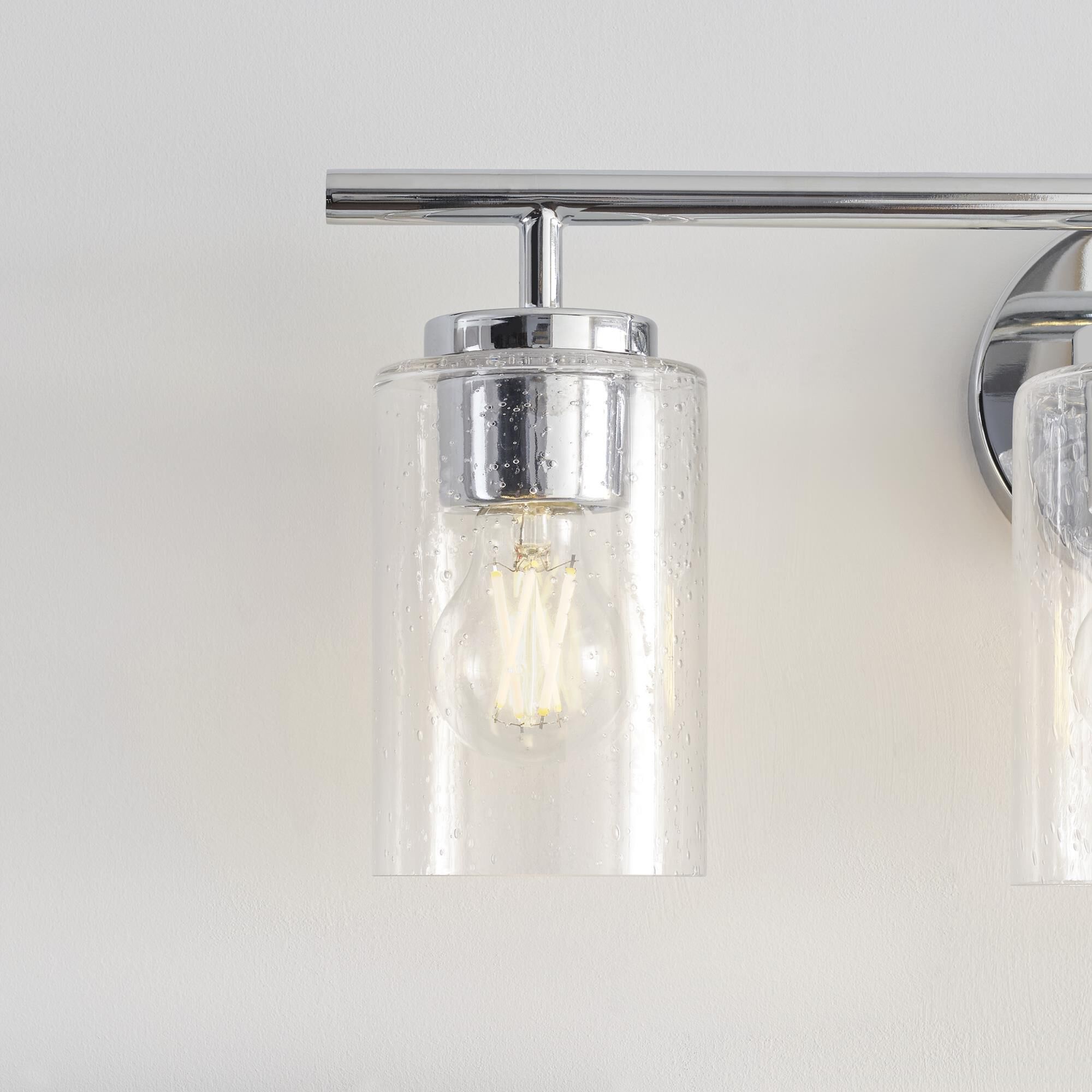 Shown in Chrome finish and Clear Seeded glass