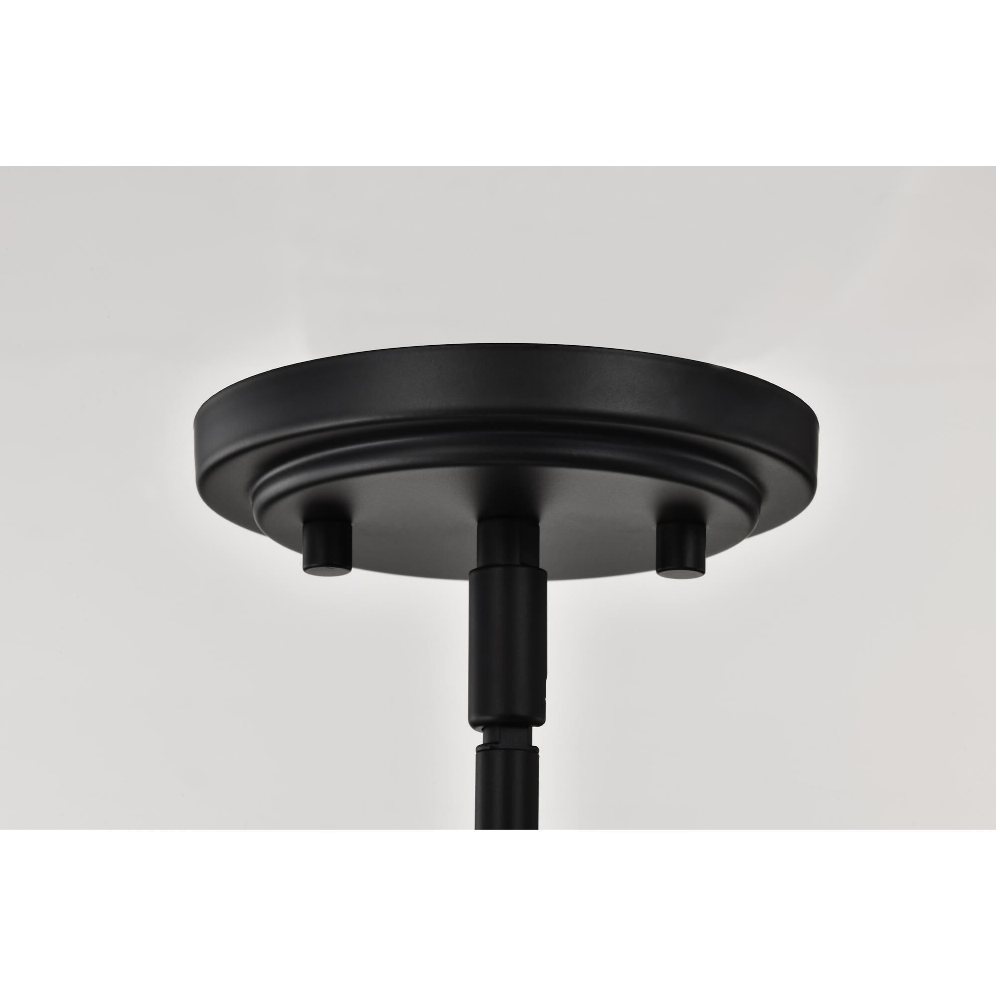 Shown in Matte Black finish and Frosted Ribbed glass