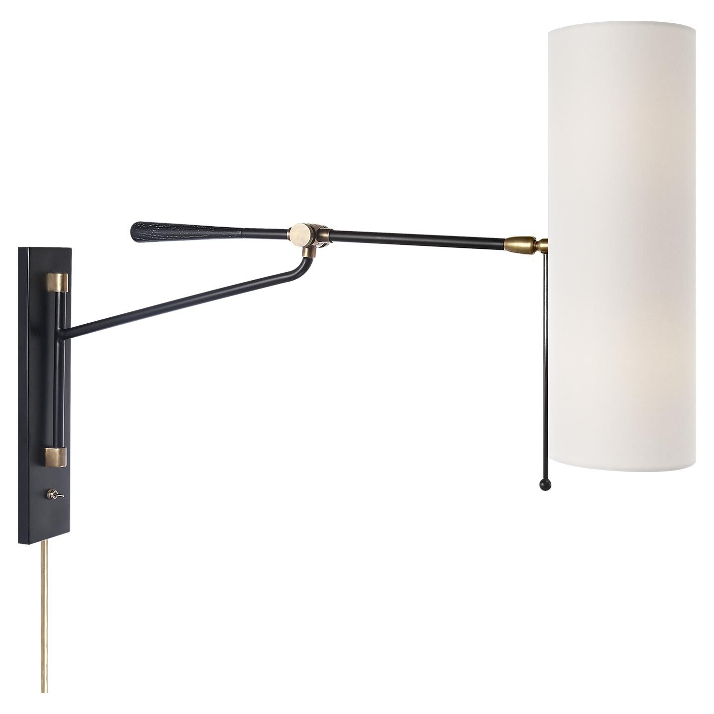 Shown in Black And Brass finish and Linen shade