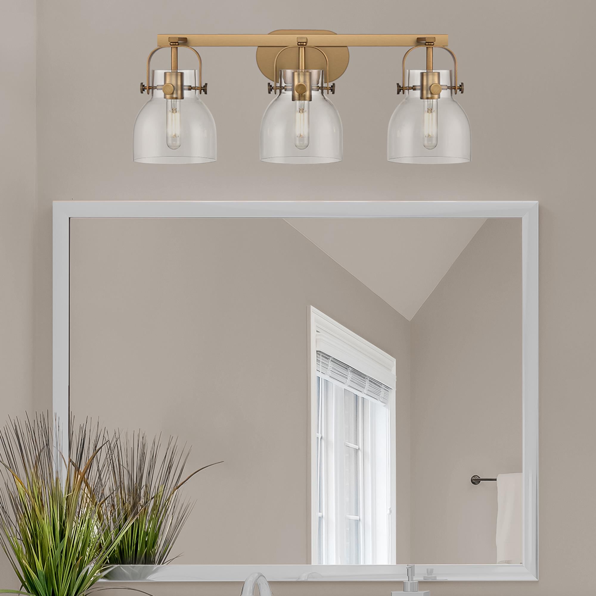 Shown in Brushed Brass finish and Clear glass