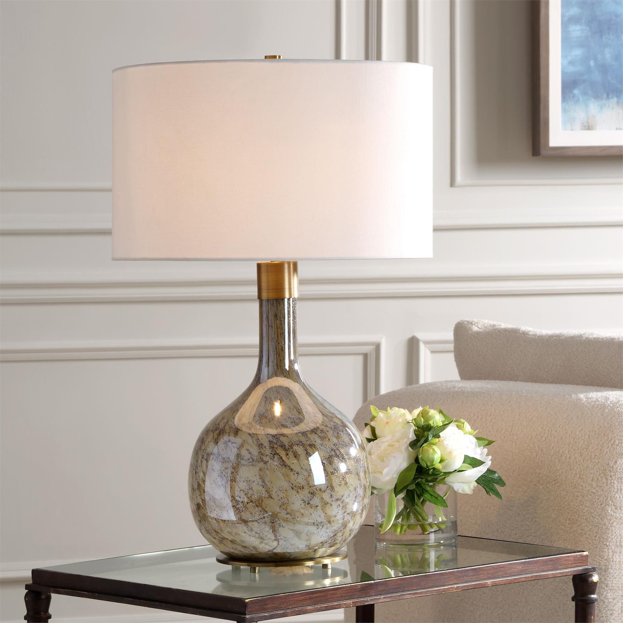 Shown in The Rhine Table Lamp Showcases A Seeded Glass Body In Warm Tones Of Light And Dark Browns Paired Wit finish and Round Drum Hardback shade