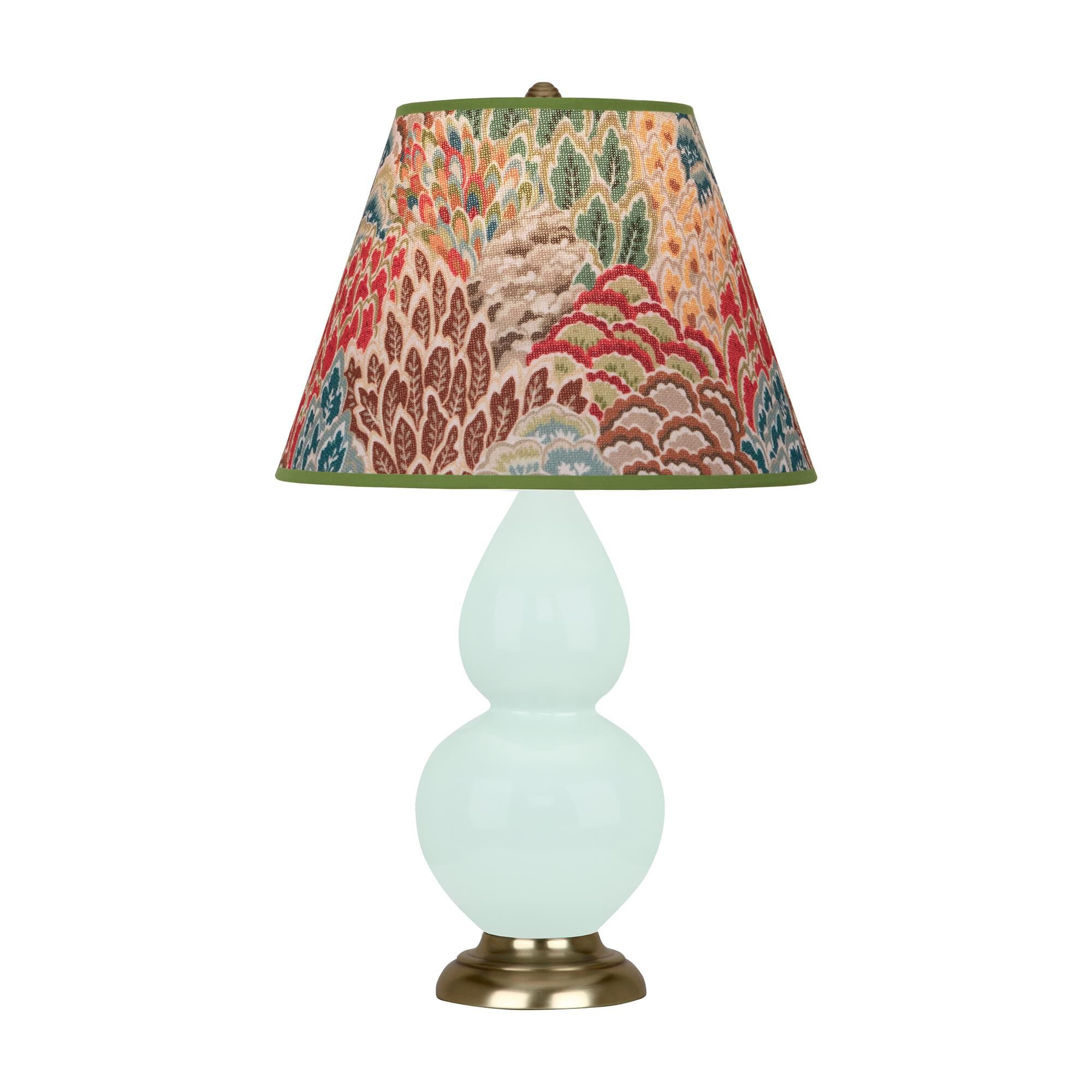 Shown in Mint Glazed finish and Fall Floral shade and Antique Brass accent