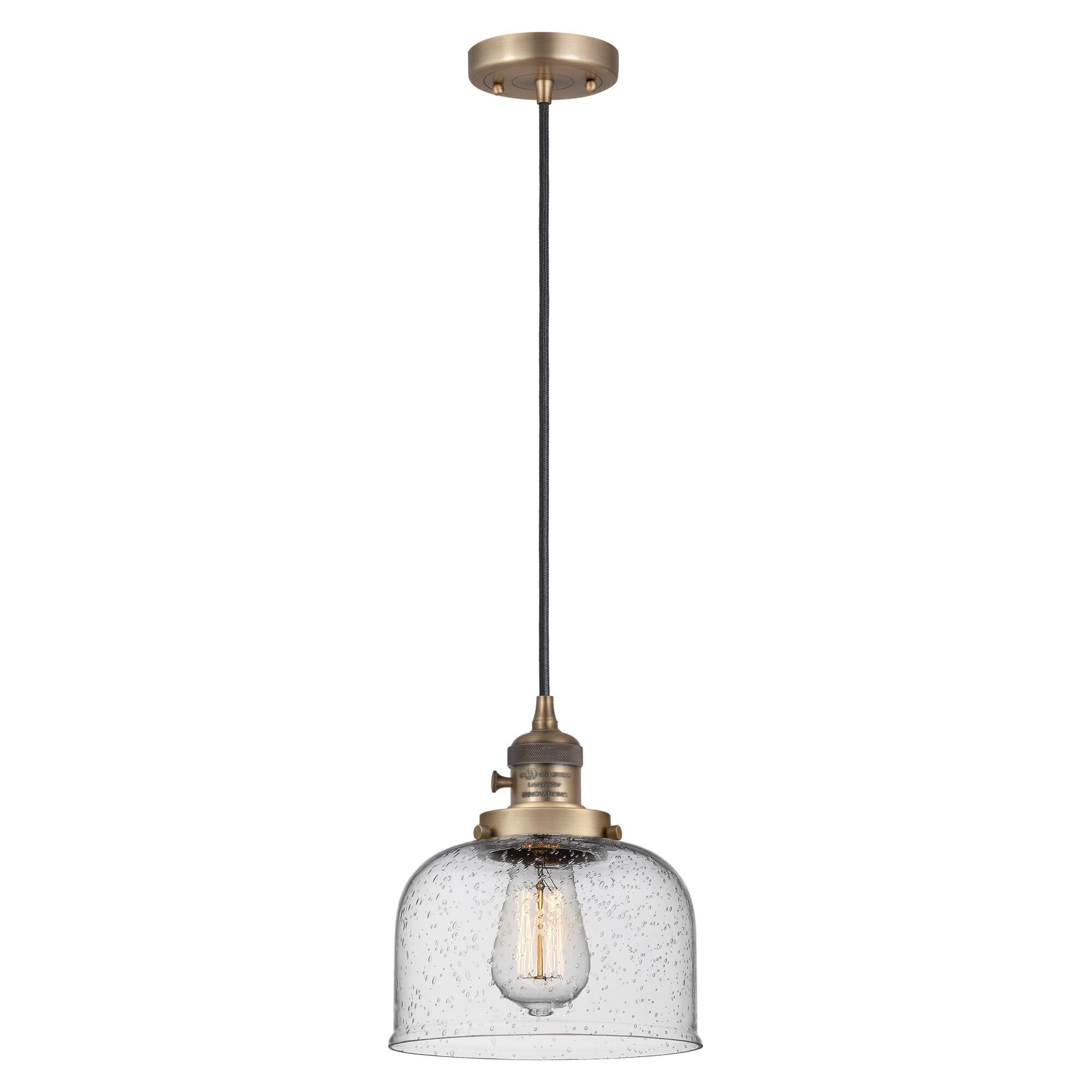 Shown in Brushed Brass finish and Seedy glass