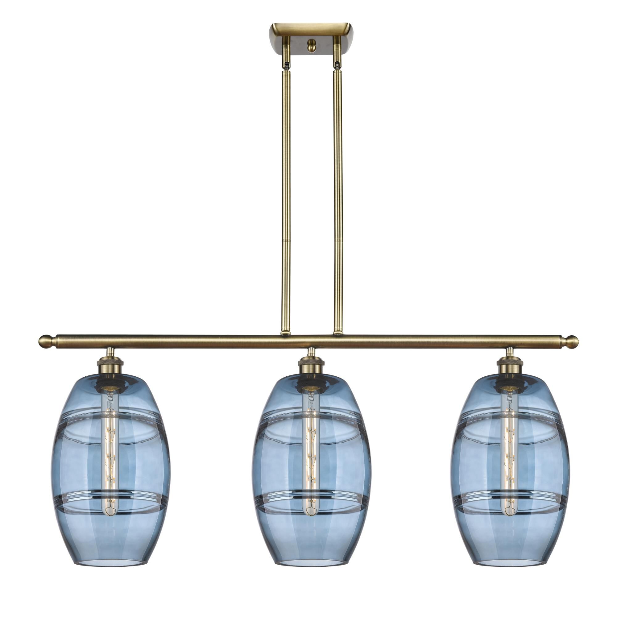Shown in Antique Brass finish and Princess Blue glass
