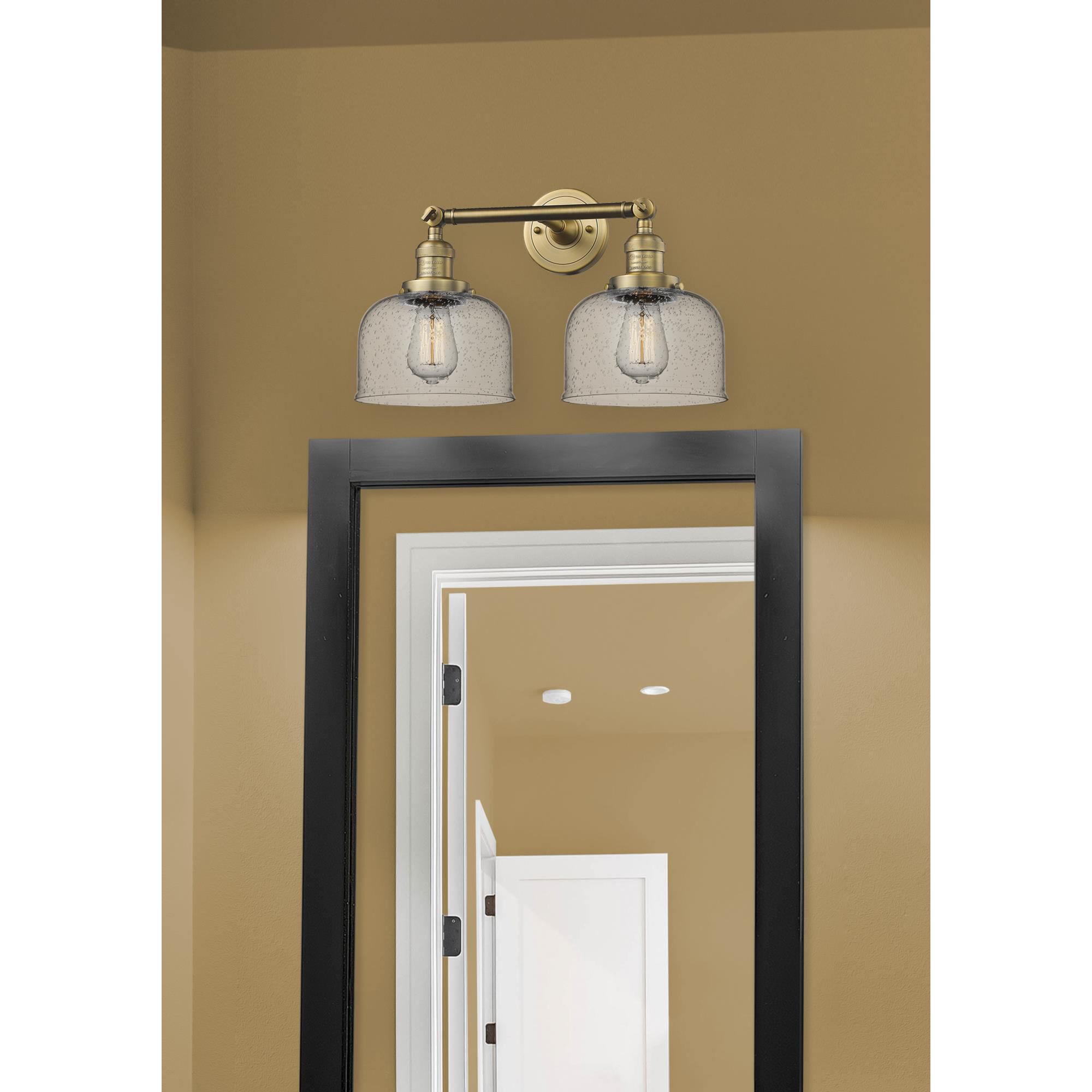 Shown in Brushed Brass finish and Seedy glass