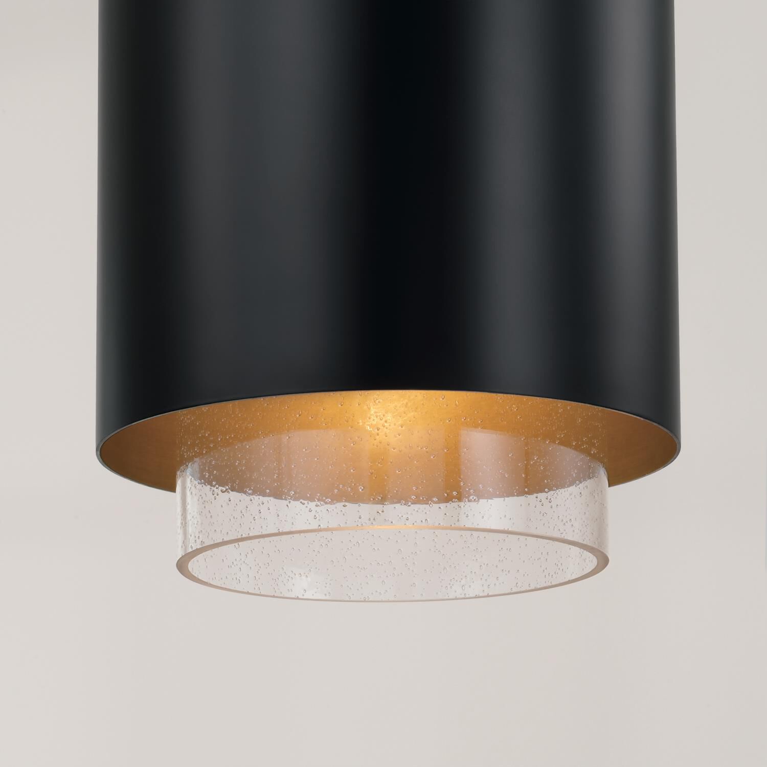 Shown in Matte Brass and Black finish and Clear Seeded glass and Metal with Brass Interior shade