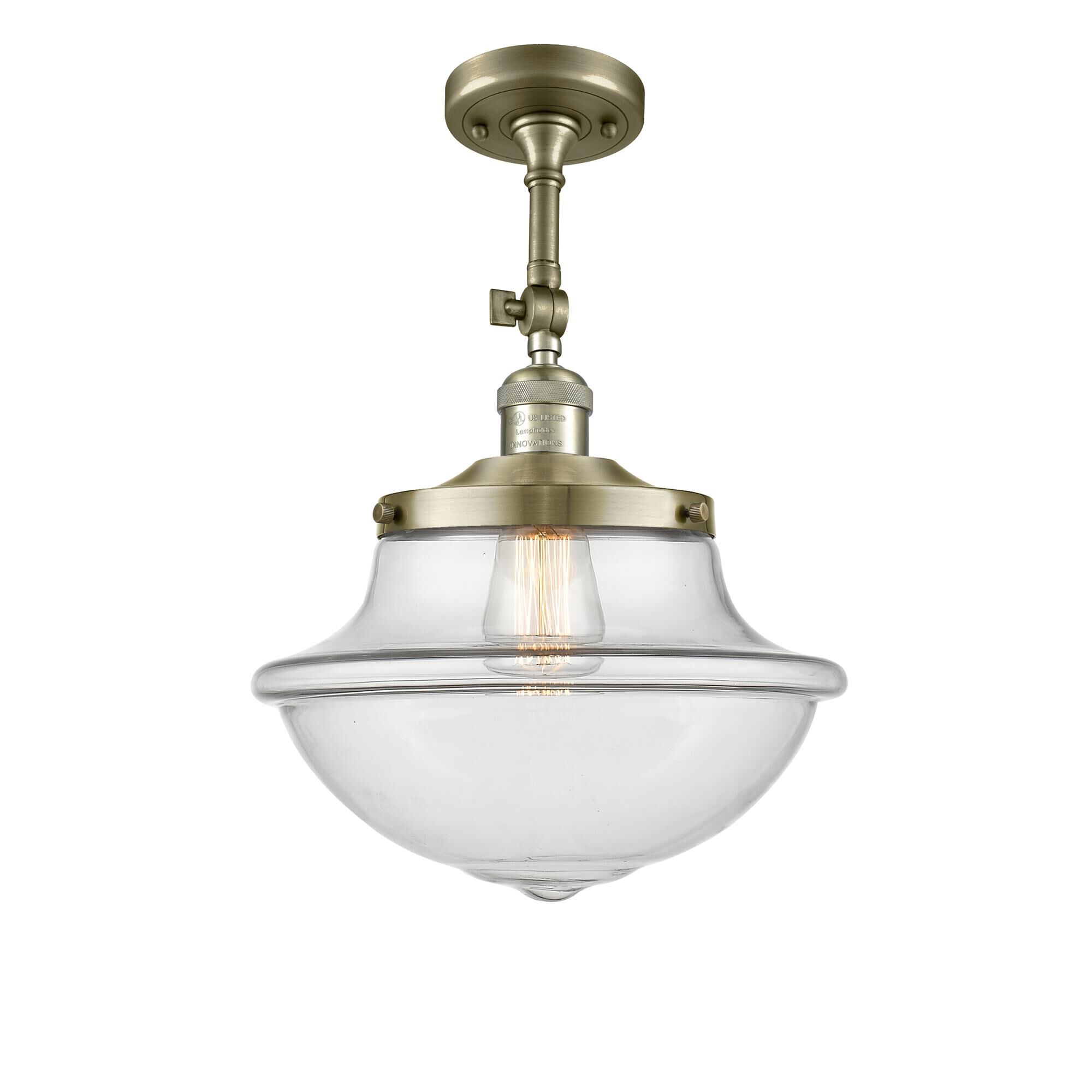 Shown in Antique Brass finish and Clear glass