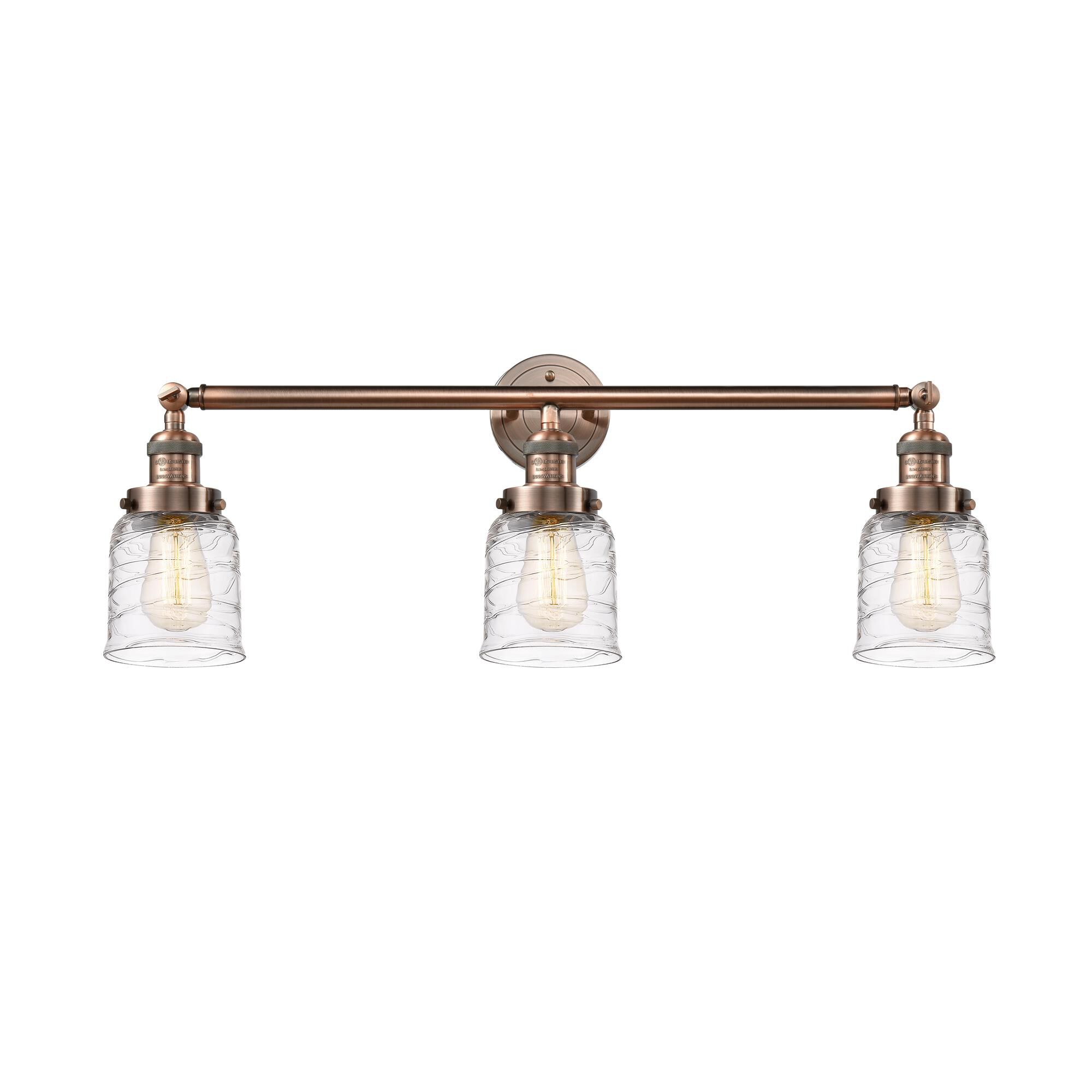 Shown in Antique Copper finish and Clear Deco Swirl Small Bell glass