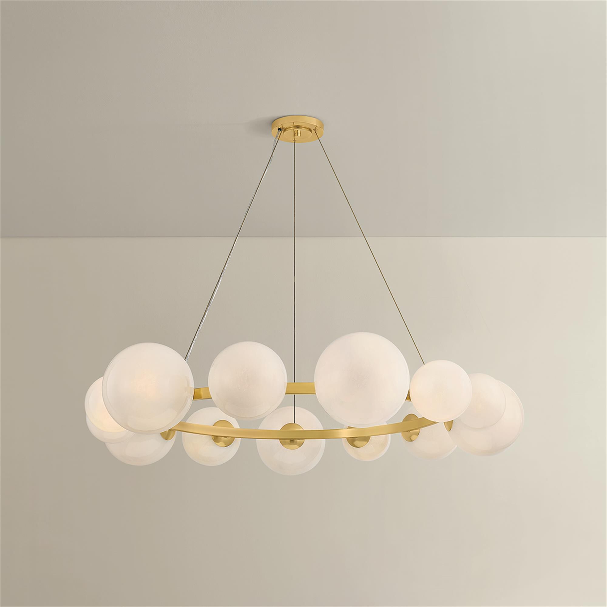 Shown in Aged Brass finish and Seeded Cloud glass