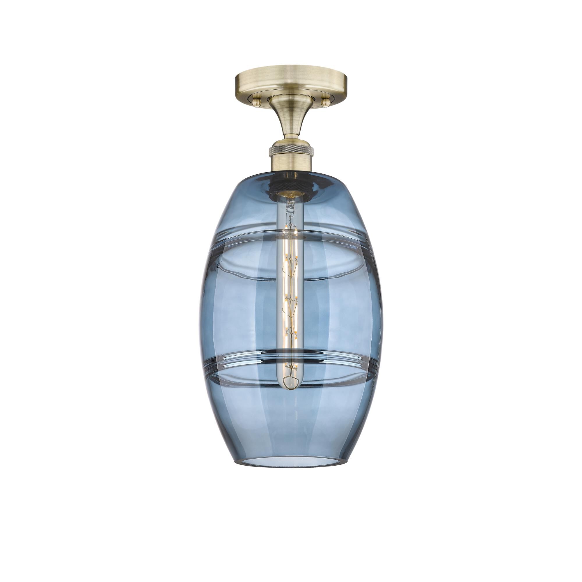 Shown in Antique Brass finish and Princess Blue glass