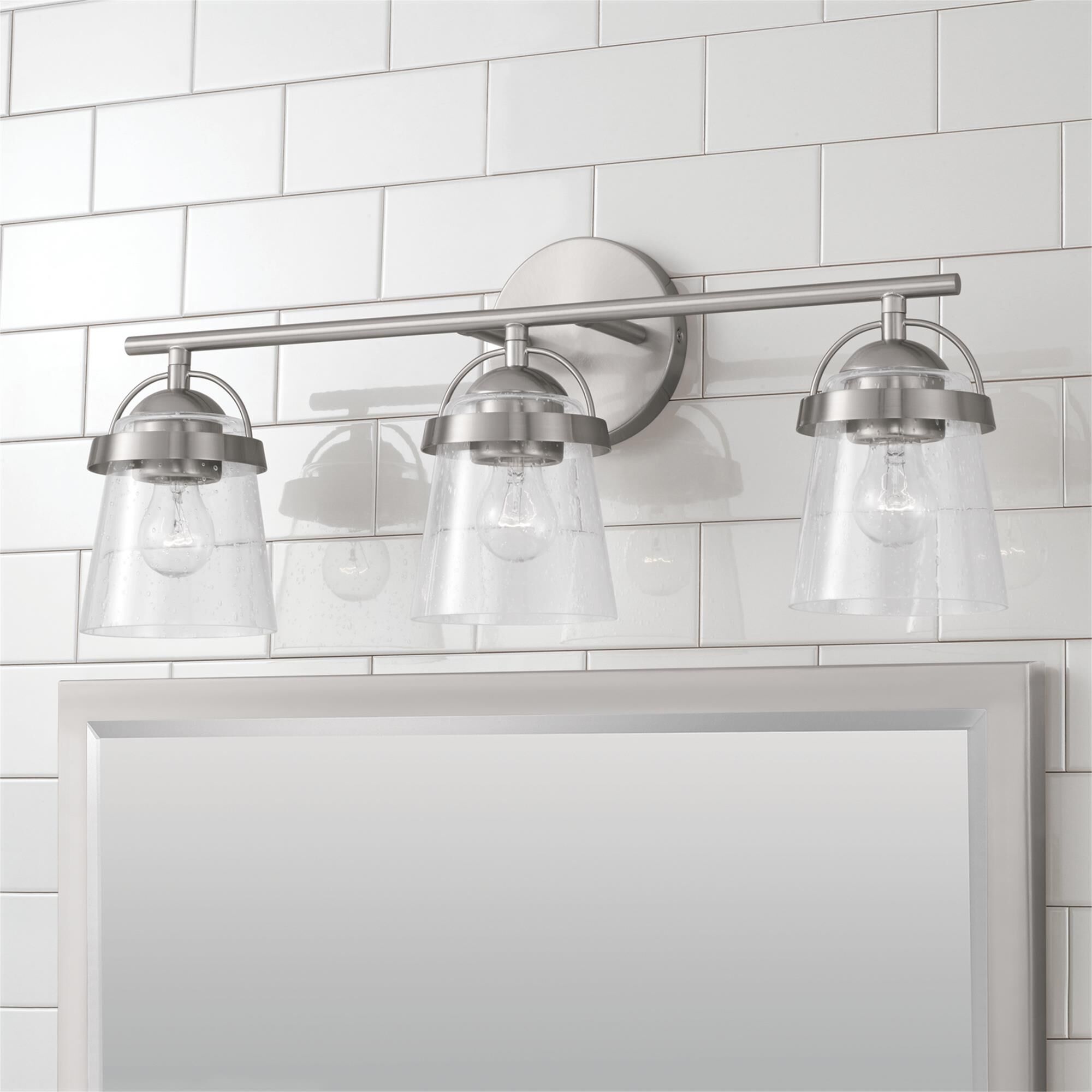 Shown in Brushed Nickel finish and Clear Seeded glass