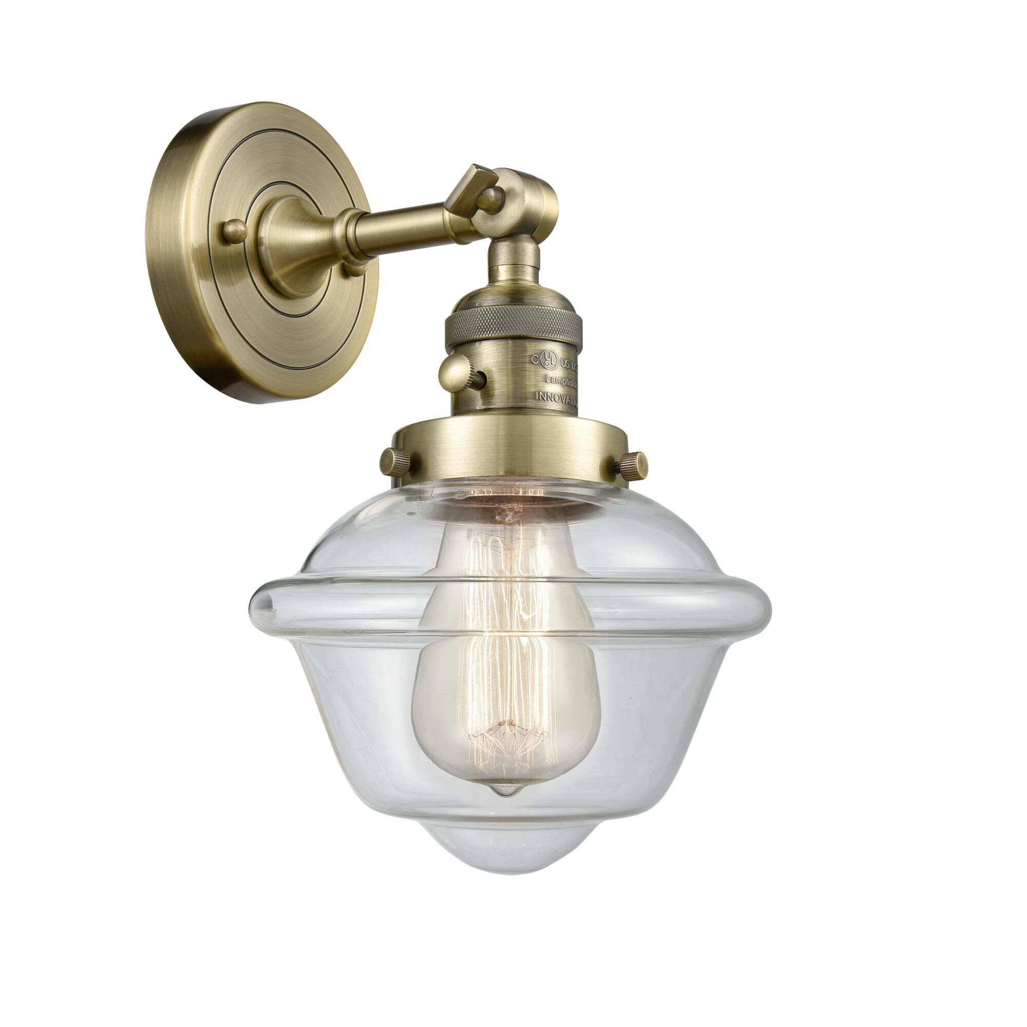 Shown in Antique Brass finish and Clear glass and Switch on Socket accent