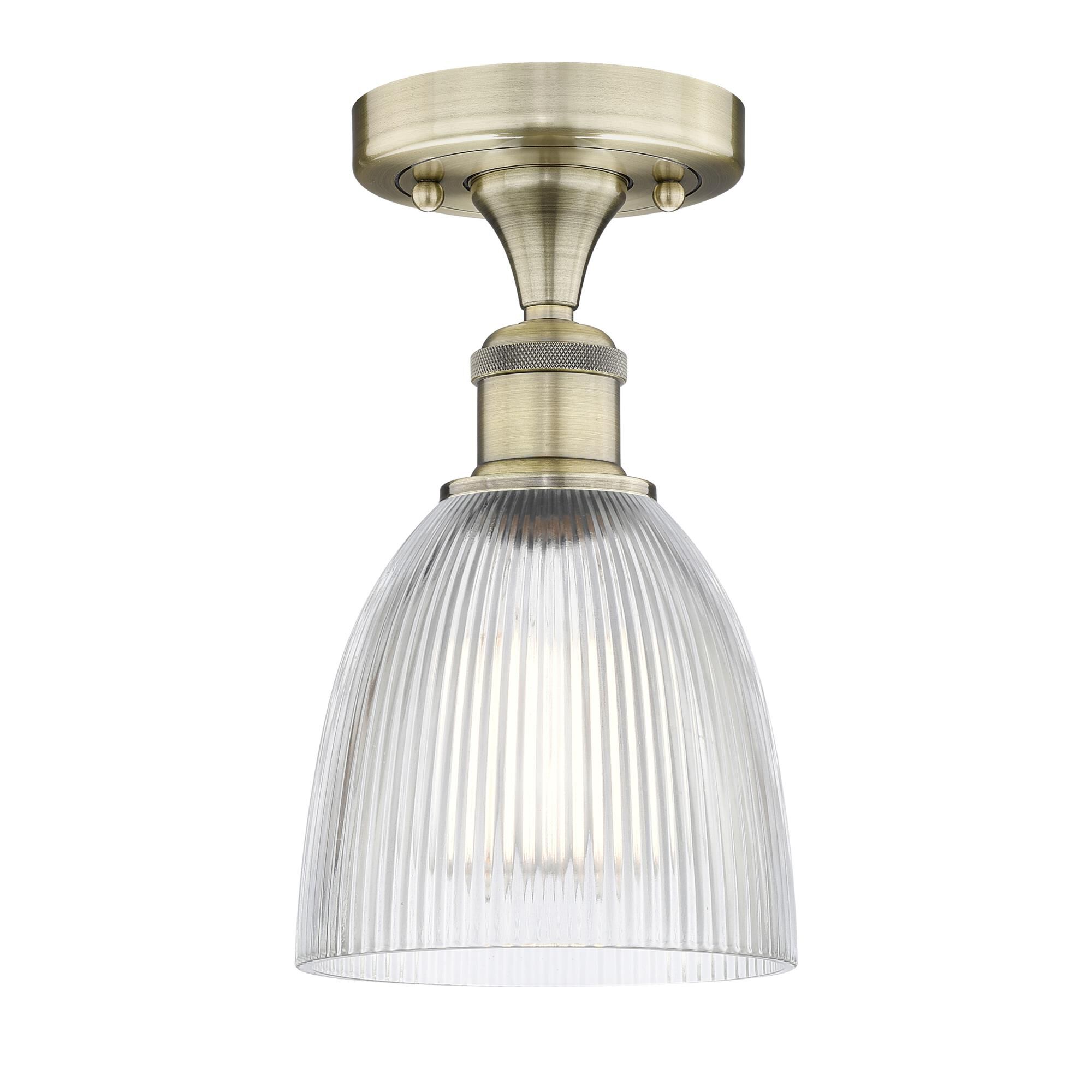 Shown in Antique Brass finish and Clear glass