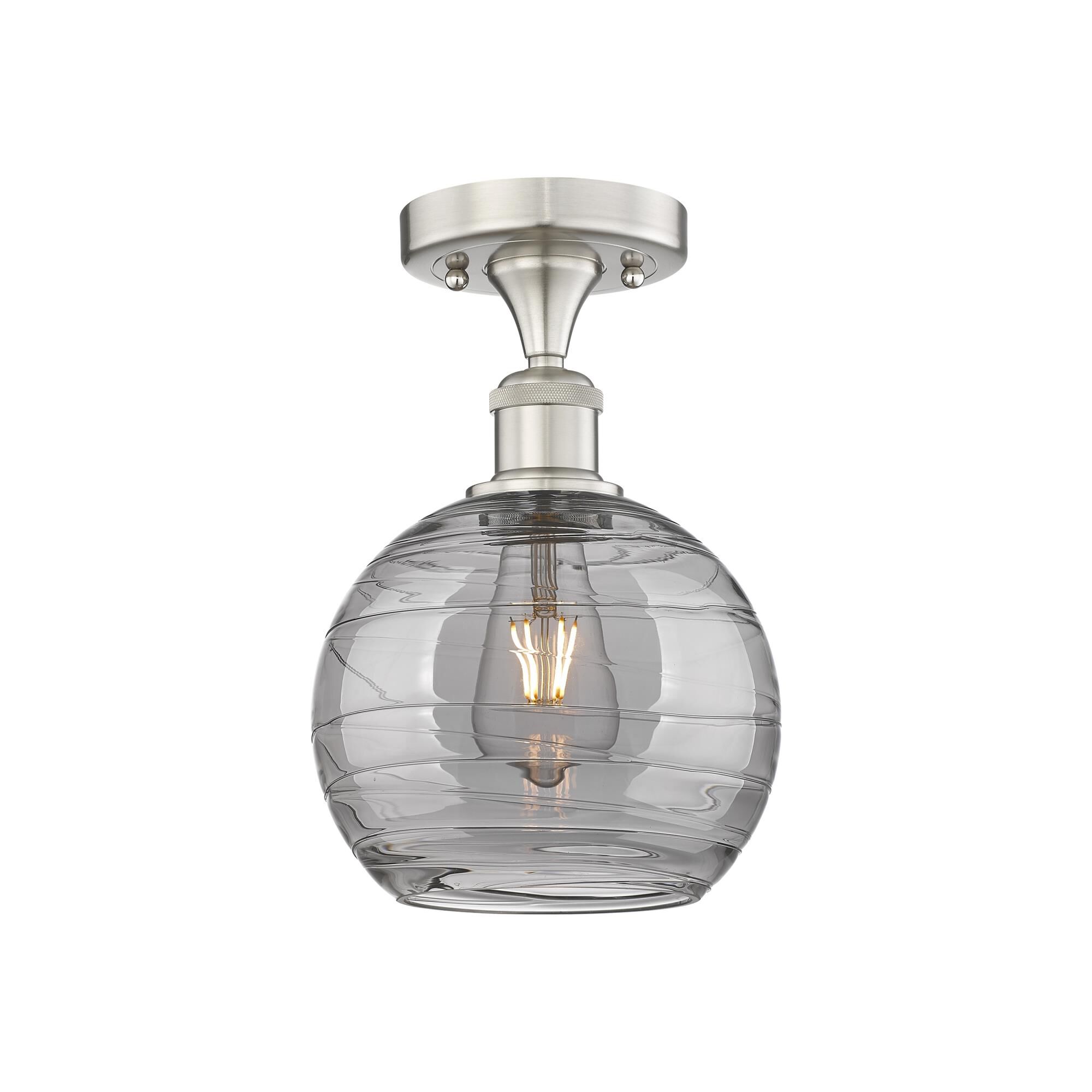 Shown in Brushed Satin Nickel finish and Light Smoke Deco Swirl glass