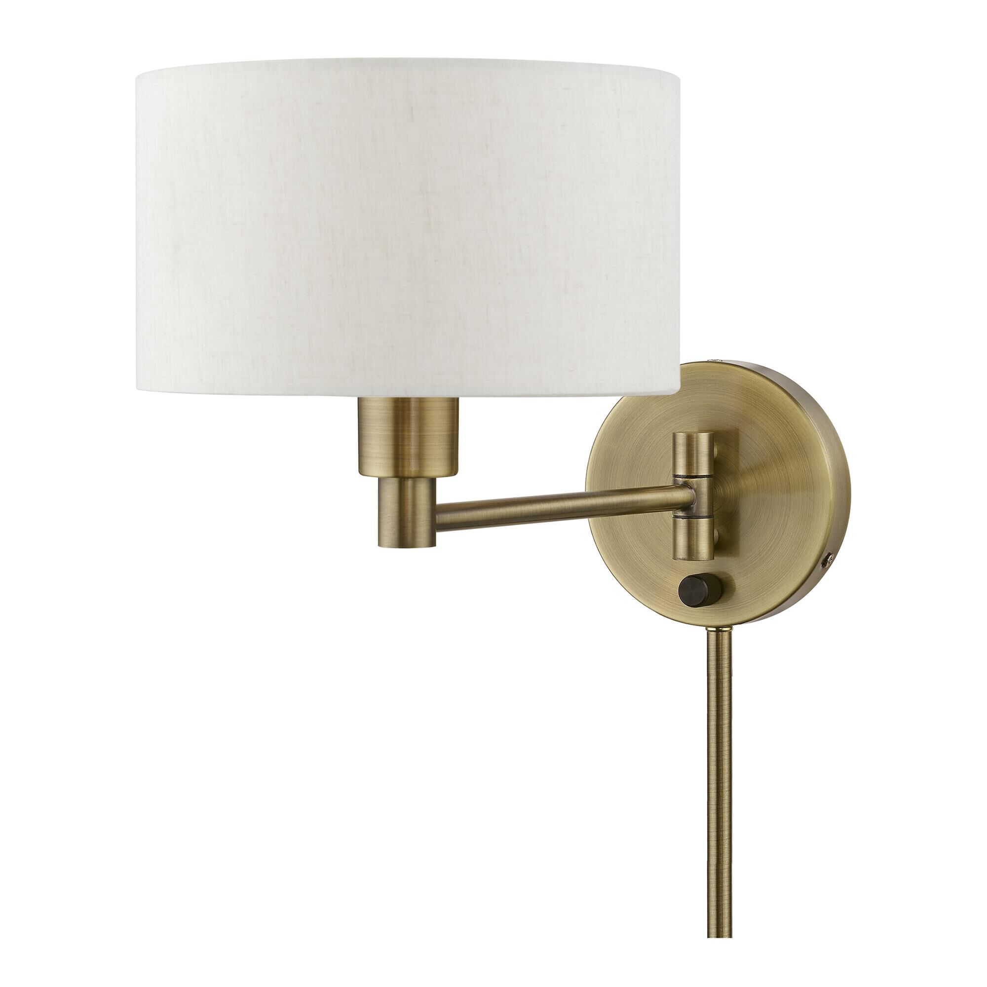 Shown in Antique Brass finish and Hand Crafted Oatmeal Color Hardback Fabric shade