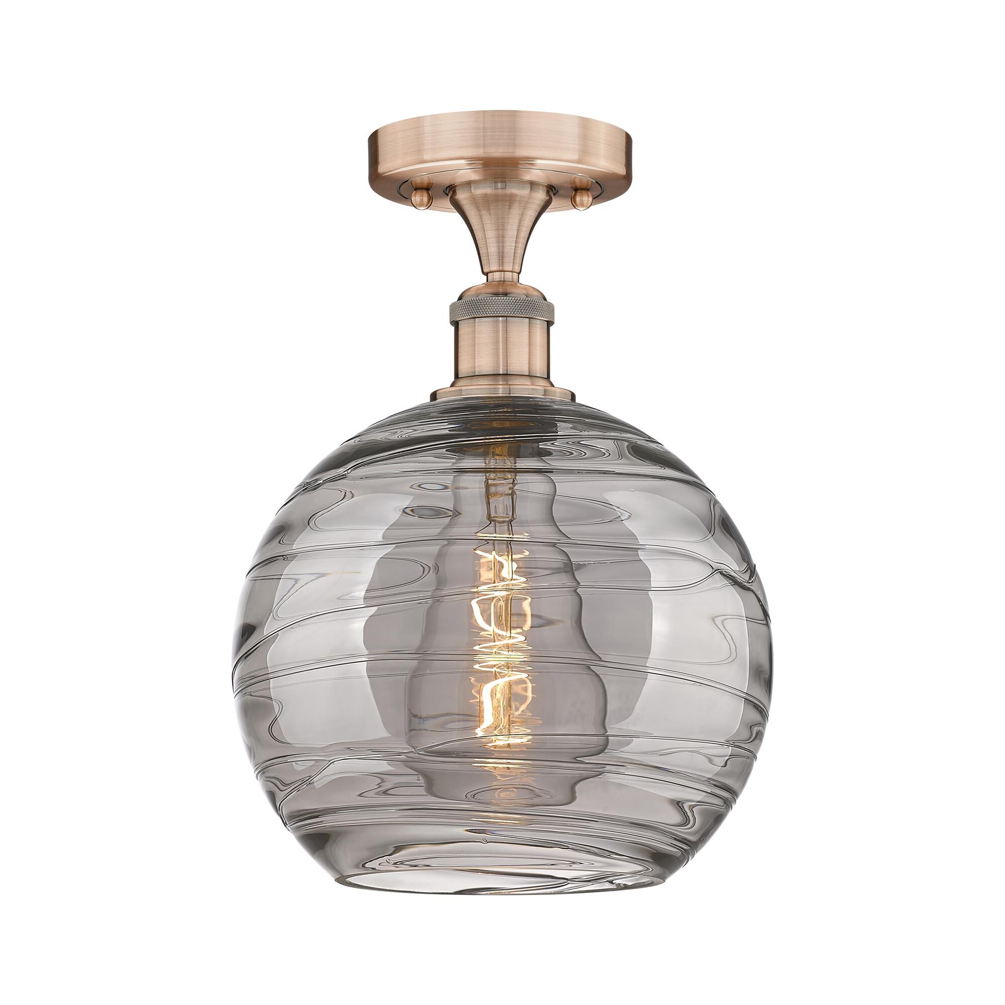 Shown in Antique Copper finish and Light Smoke Deco Swirl glass