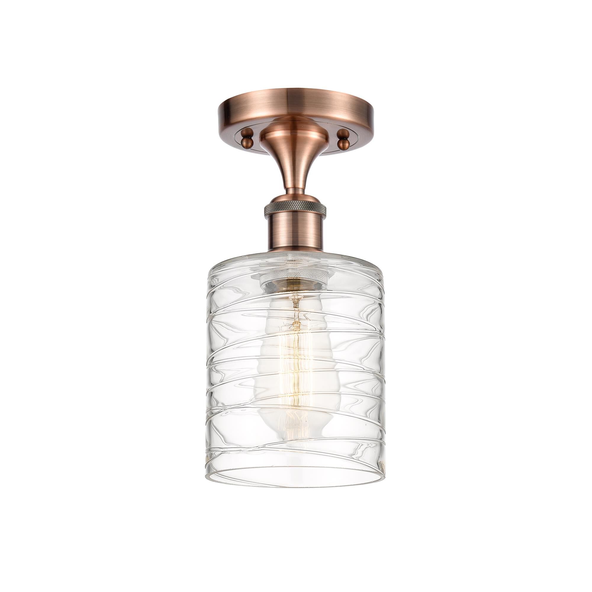 Shown in Antique Copper finish and Deco Swirl Cobbleskill glass