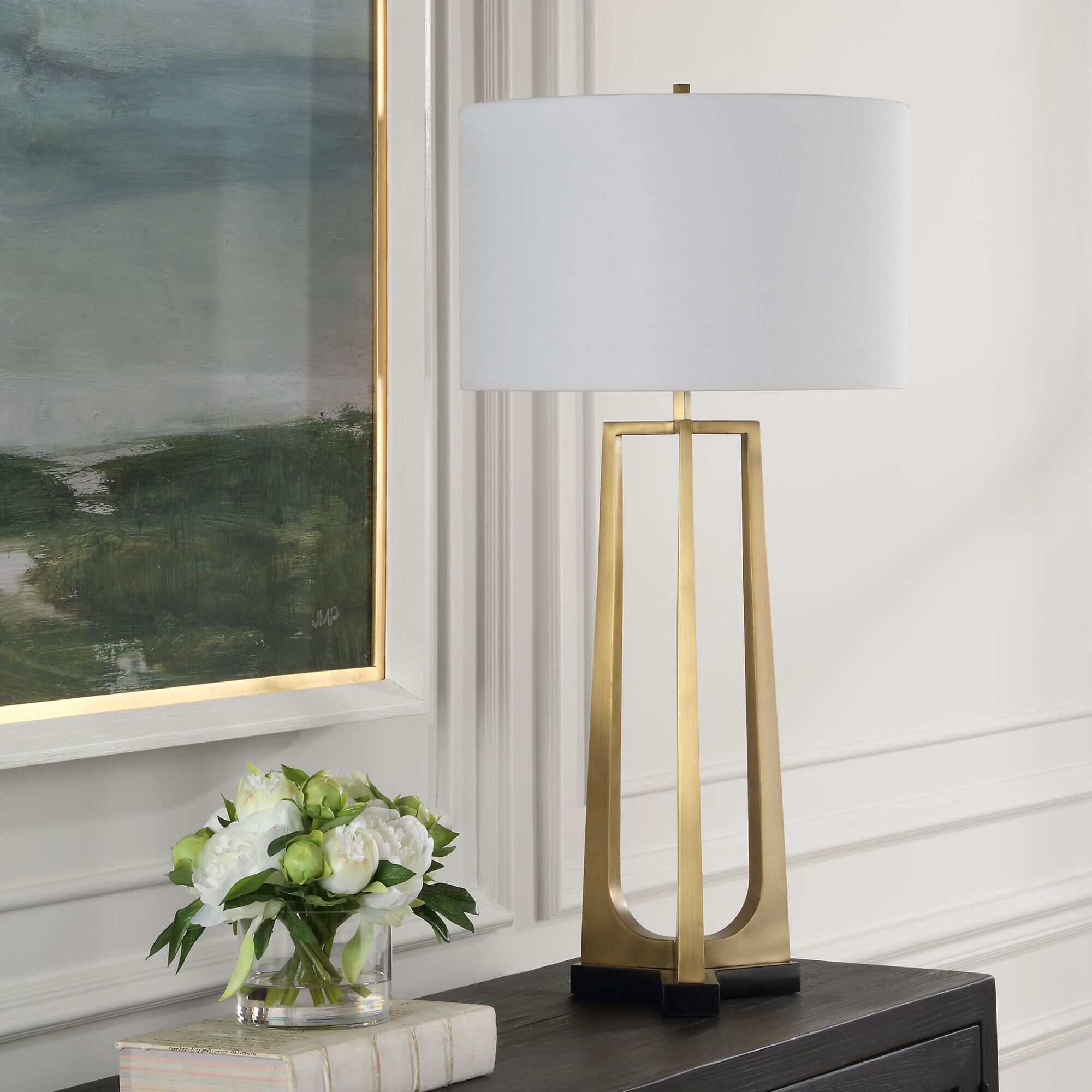 Shown in This Table Lamp Features A Sleek Iron Base With Three Tapered Legs Finished In Plated Antique Brass, finish and Round Drum Hardback shade