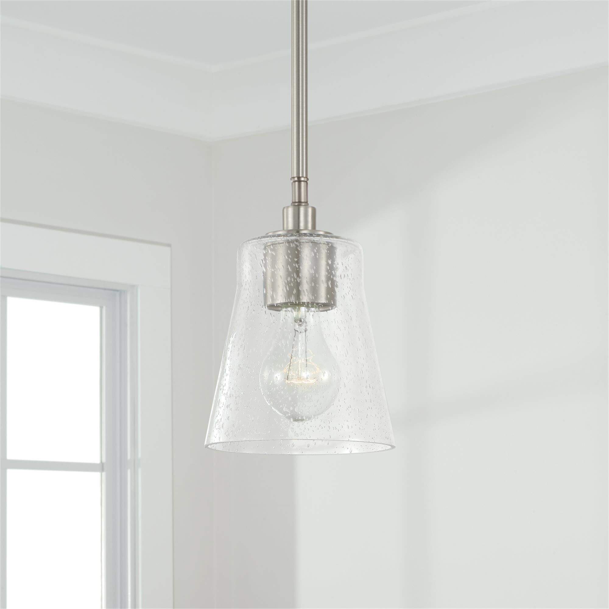 Shown in Brushed Nickel finish and Clear Seeded glass