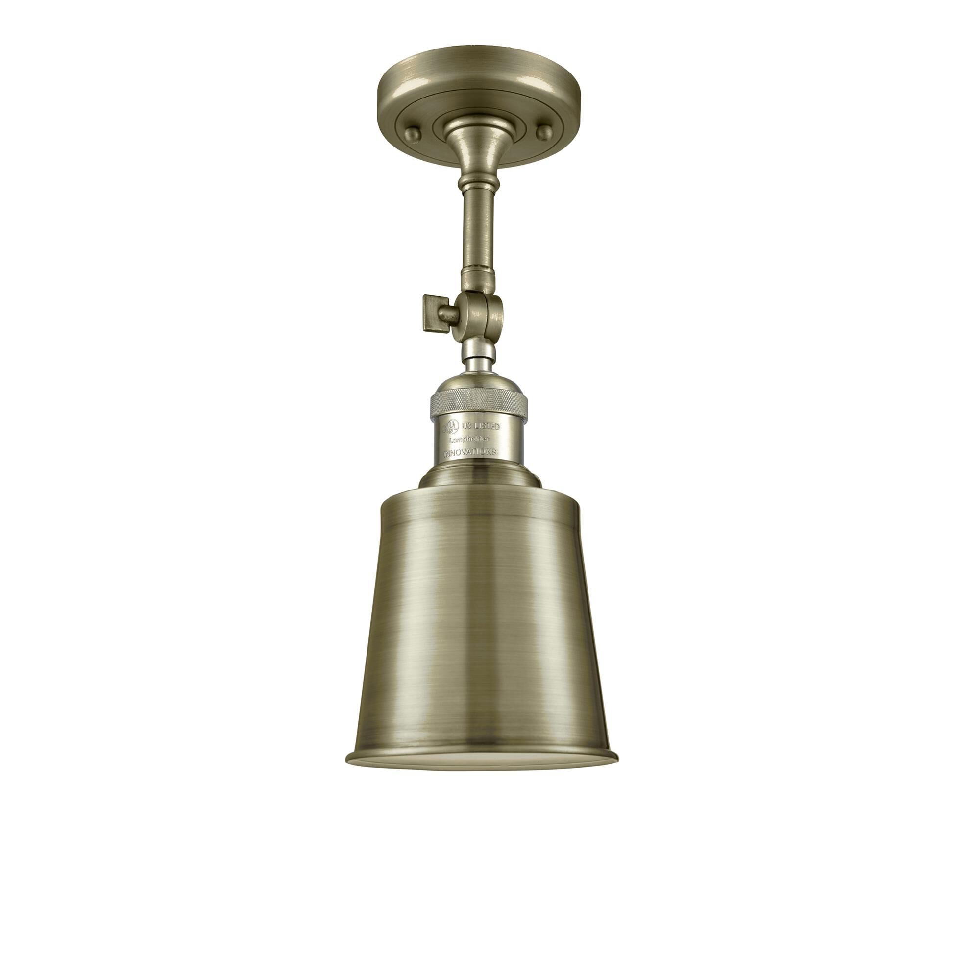 Shown in Antique Brass finish and Antique Brass shade