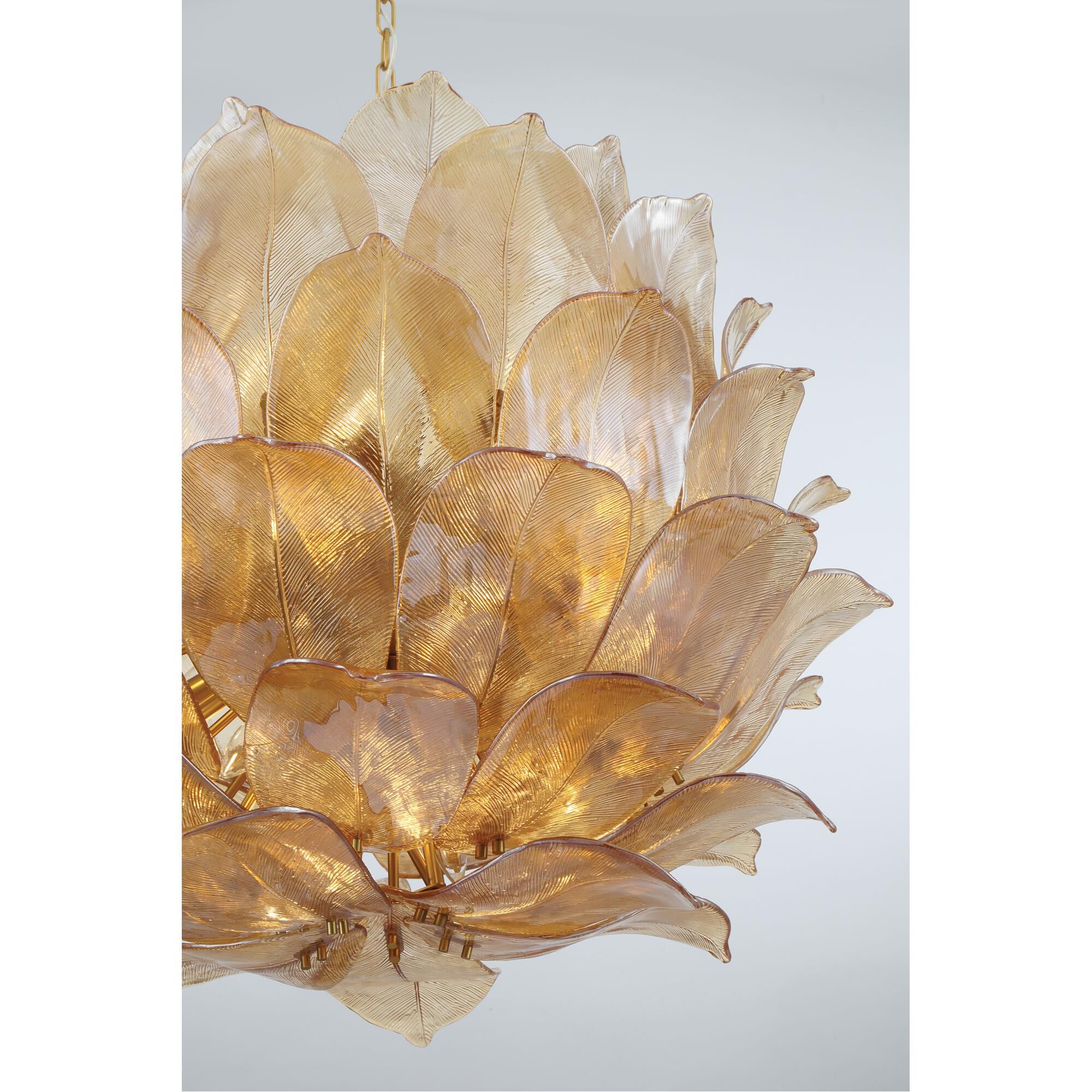 Shown in Legacy Brass finish and Amber Handmade glass