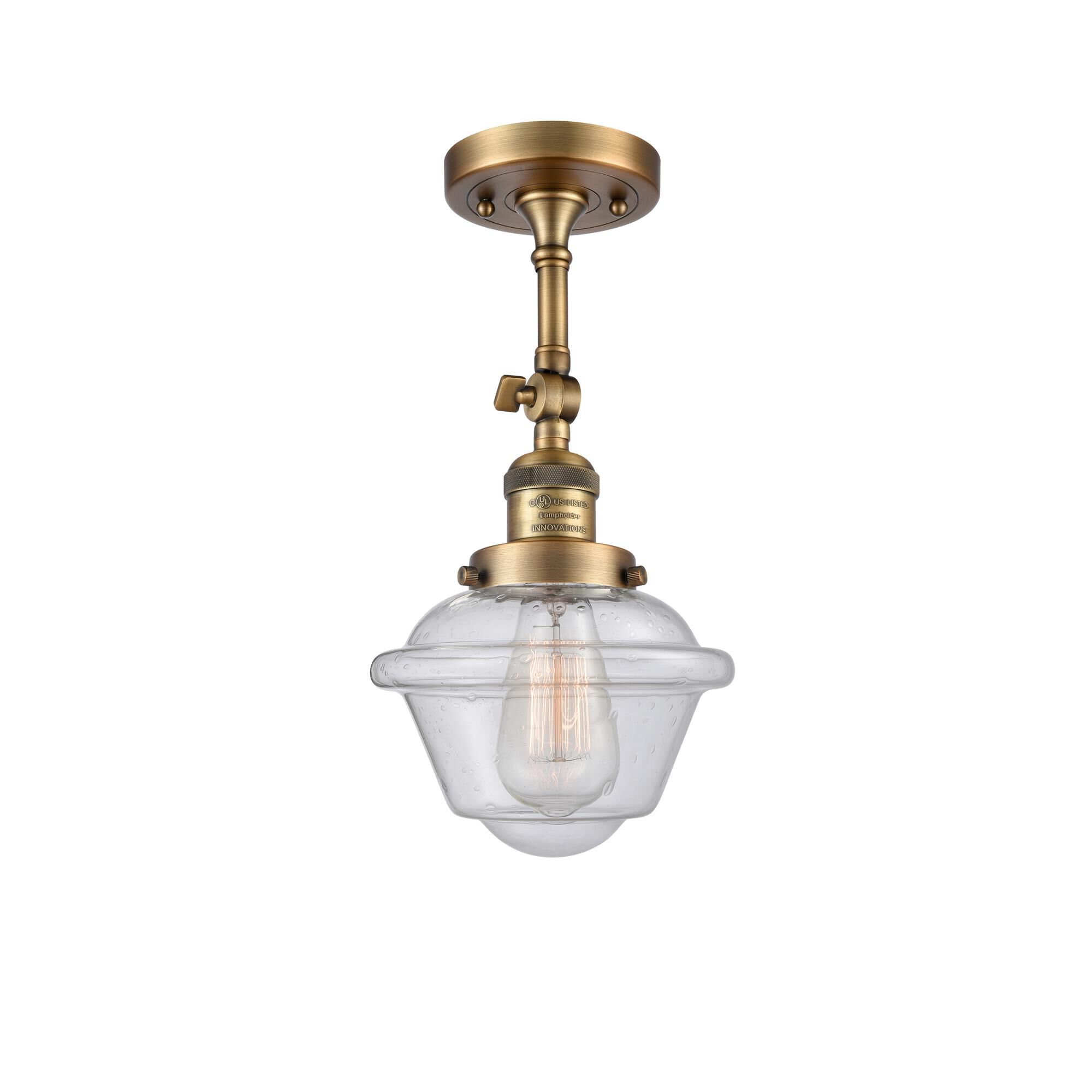 Shown in Brushed Brass finish and Seedy glass