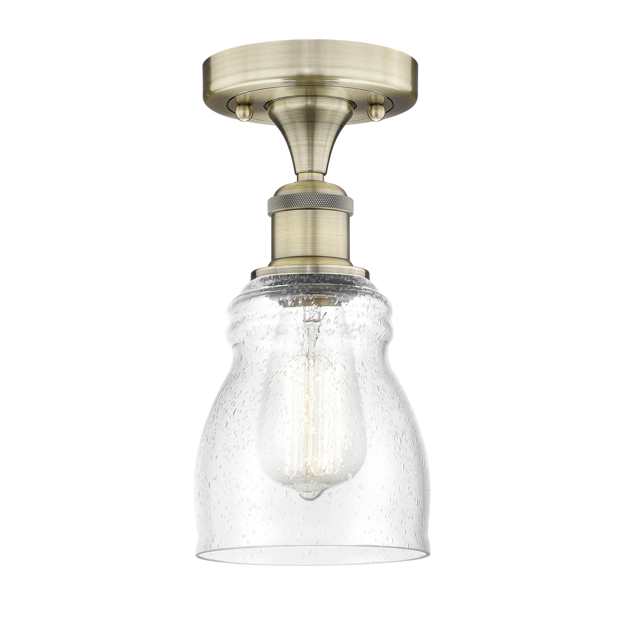 Shown in Antique Brass finish and Seedy glass