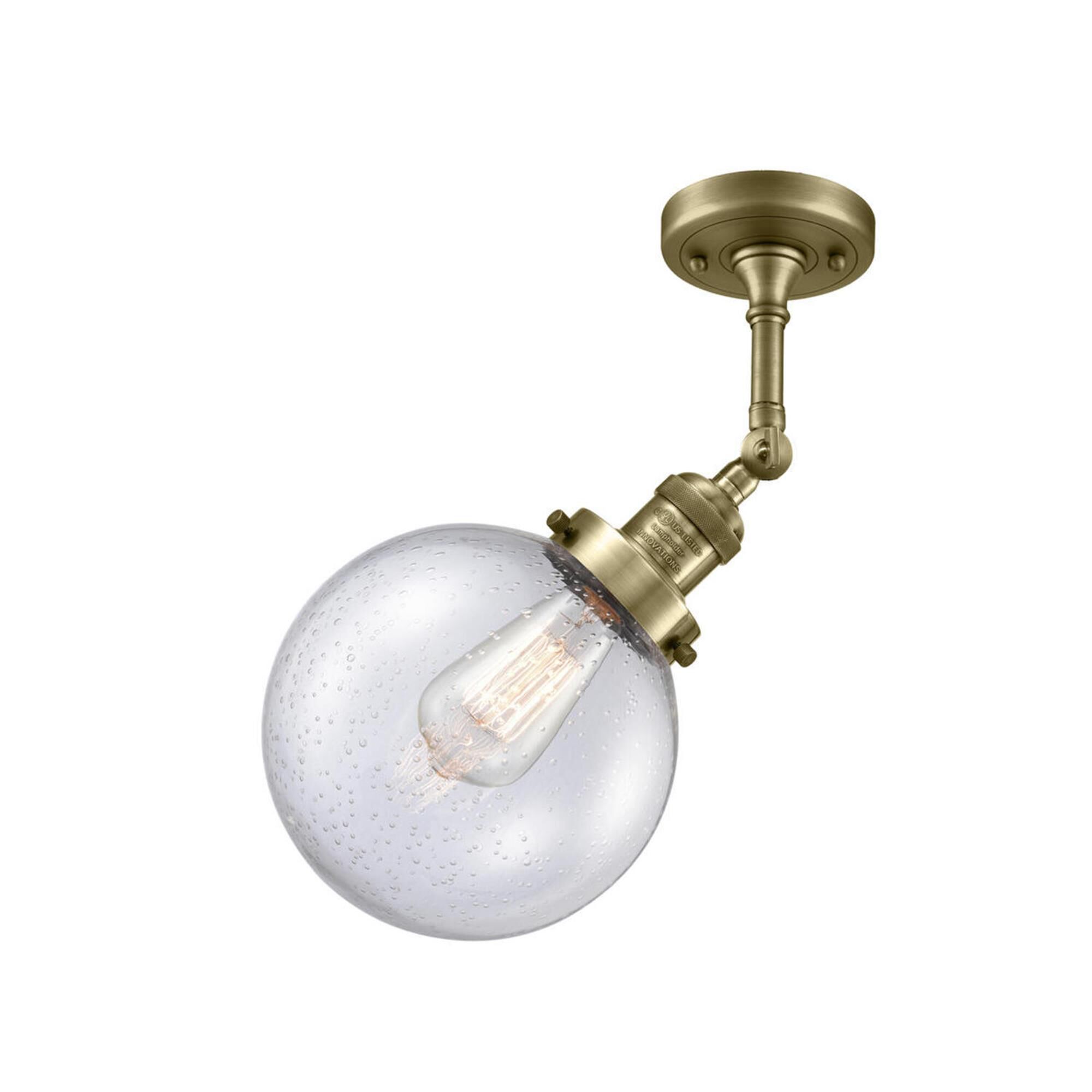 Shown in Antique Brass finish and Seedy glass and No Accent accent
