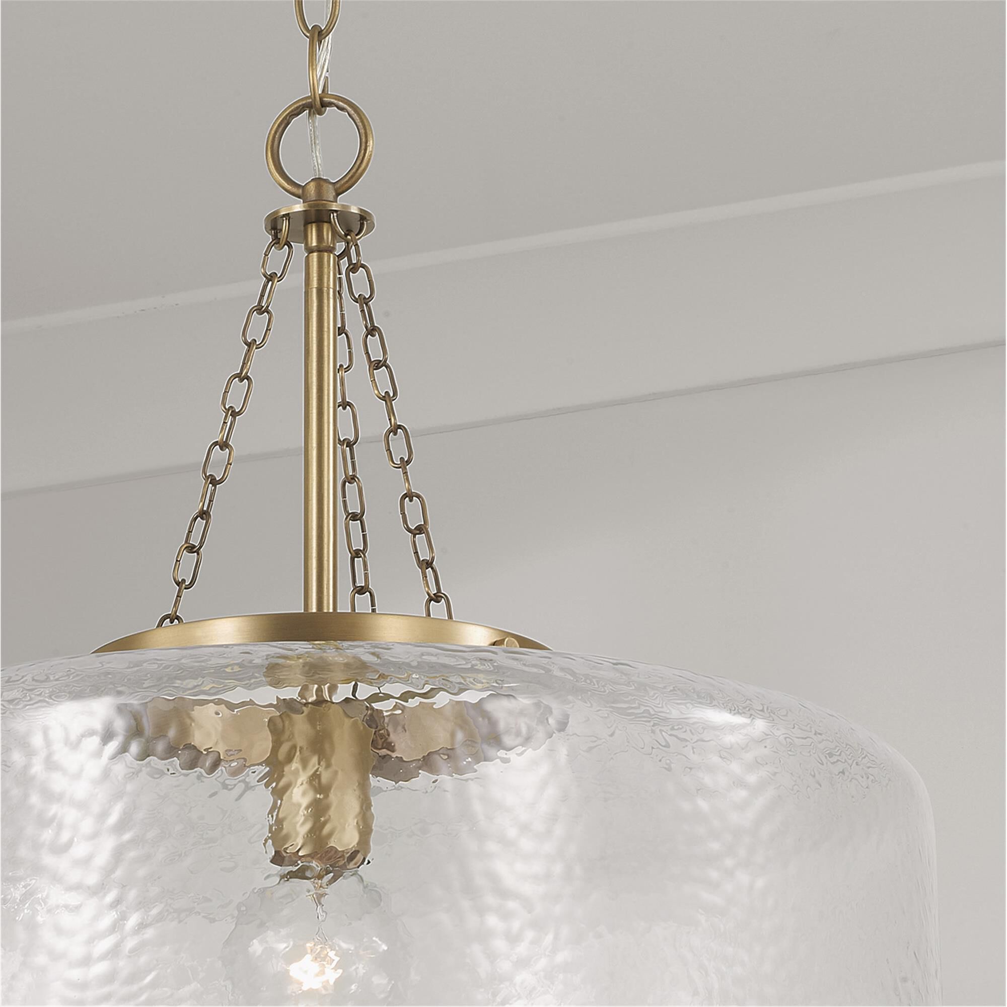 Shown in Aged Brass finish and Organic Hammered glass